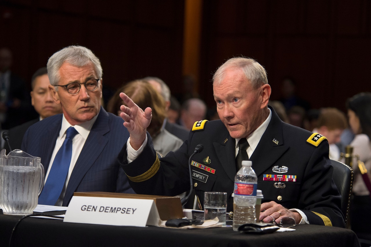 Army Gen. Martin E. Dempsey, chairman of the Joint Chiefs of Staff, right, and Defense Secretary Chuck Hagel testify on U.S. policy regarding the threat from the Islamic State of Iraq and the Levant, known as ISIL, before the Senate Armed Services Committee in Washington, D.C., Sept. 16, 2014. DoD photo by Petty Officer 1st Class Daniel Hinton 
