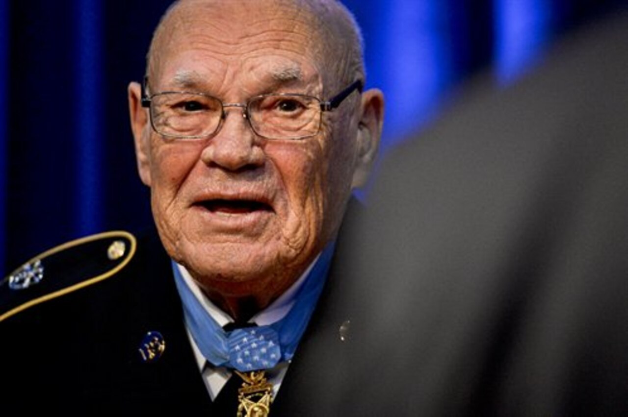 Retired Army Command Sgt. Maj. Bennie G. Adkins tells a joke before Defense Secretary Chuck Hagel inducts him into the Hall of Heroes during a ceremony at the Pentagon, Sept. 16, 2014. Hagel also inducted Army Spc. 4 Donald P. Sloat, who was awarded the Medal of Honor posthumously, into the Hall of Heroes. President Barack Obama personally award the Medal of Honor to Adkins and posthumously to Sloat the day before at the White House. DoD photo by U.S. Navy Petty Officer 2nd Class Sean Hurt