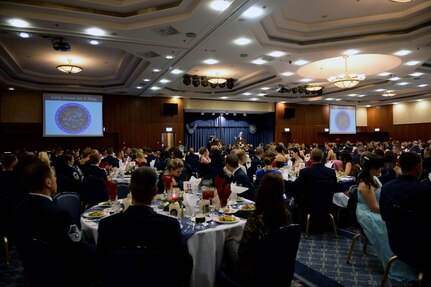 Airmen and their families attend an Air Force ball at the Club Eifel on Spangdahlem Air Base, Germany. Air Force clubs are a place where Airmen can experience Air Force heritage and tradition. (U.S. Air Force photo/Airman 1st Class Timothy Kim)