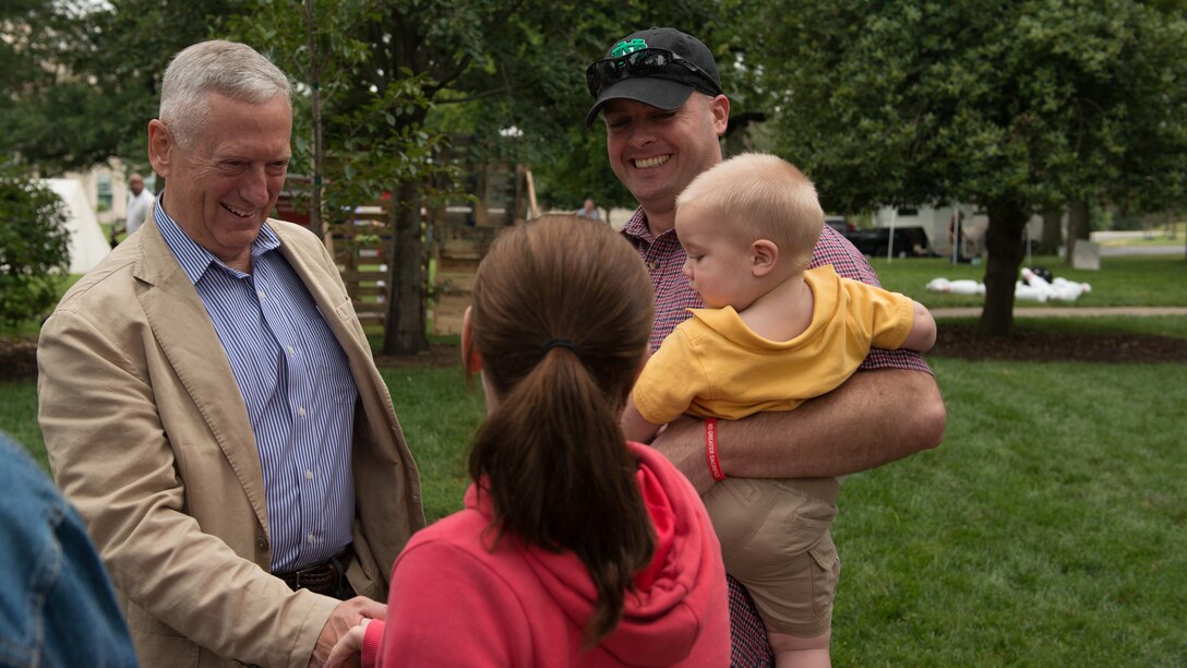 Retired Gen. James Mattis greets a Marine family during the festivities at the No Greater Sacrifice 2014 Freedom Award Family Day, Washington D.C., September 13, 2014. Mattis is this years Freedom Award recipient.
(U.S. Marine Corps photo by Sgt. Melissa Karnath/Released)

