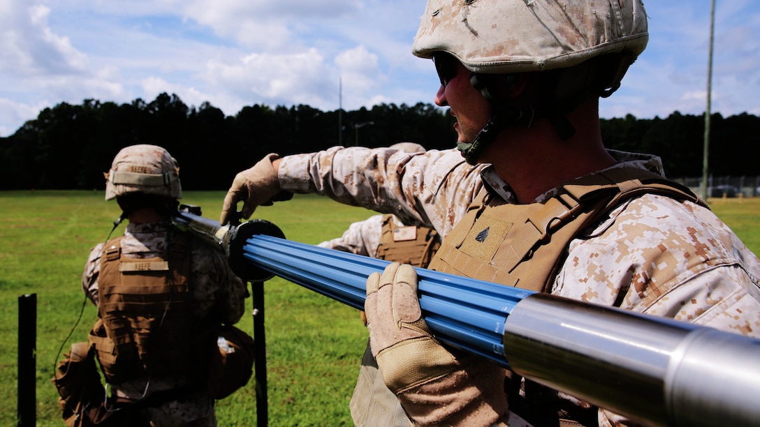 Sgt. Ben W. Cole loads a round into a PL-87 Stinger missile during a simulated missile shoot as part of 2nd Low Altitude Air Defense Battalion’s section leader course and team leader course at Marine Corps Air Station Cherry Point, N.C., Sept. 11, 2014. Cole is a course instructor with 2nd LAAD and is a native of Linden, Mich.