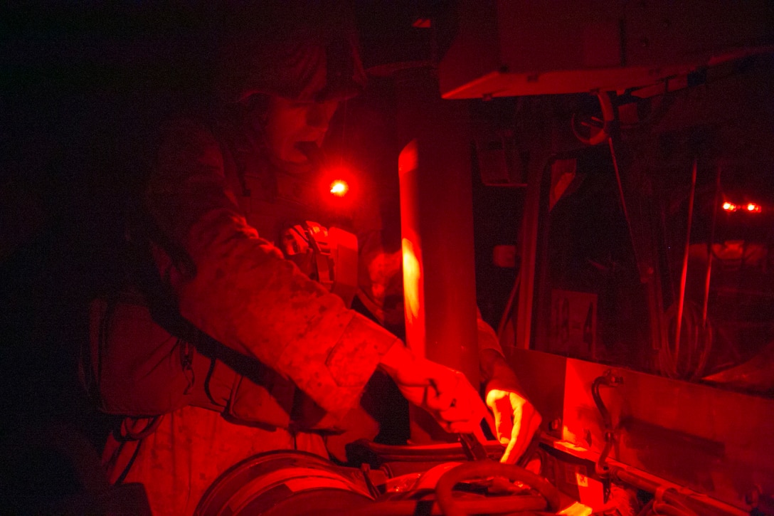 Chief Warrant Officer Anthony P. Brown fixes a Humvee Aug. 30 during Artillery Relocation Training Program 14-2 at the Yausubetsu Maneuver Area in Hokkaido, Japan. Marines at the administrative logistics ordnance command are responsible for maintaining and supplying three batteries during ARTP 14-2. Brown is a Decorah, Iowa, native and motor transport officer with 3rd Battalion, 12th Marine Regiment, 3rd Marine Division, III Marine Expeditionary Force. (U.S. Marine Corps photo by Sgt. Matthew Manning/Released)