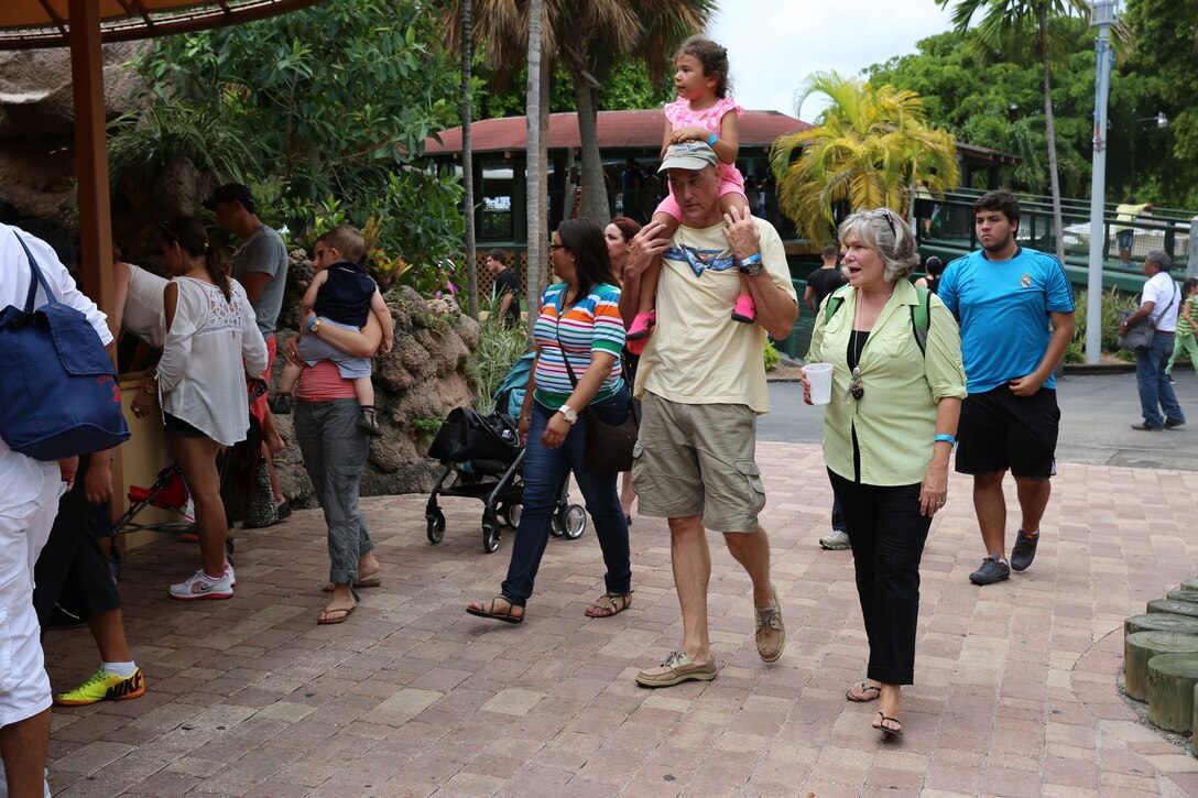 MIAMI— Brigadier General David W. Coffman walks with his wife and daughter to the string ray exhibit at the Miami Seaquarium.  Coffman, commander for U.S. Marine Corps Forces South, hosted a fall family day at the Miami Seaquarium for the Marines and their families under his command Sept. 6, 2014. (Official Marine Corps photo by SSgt. Earnest J. Barnes//Released)