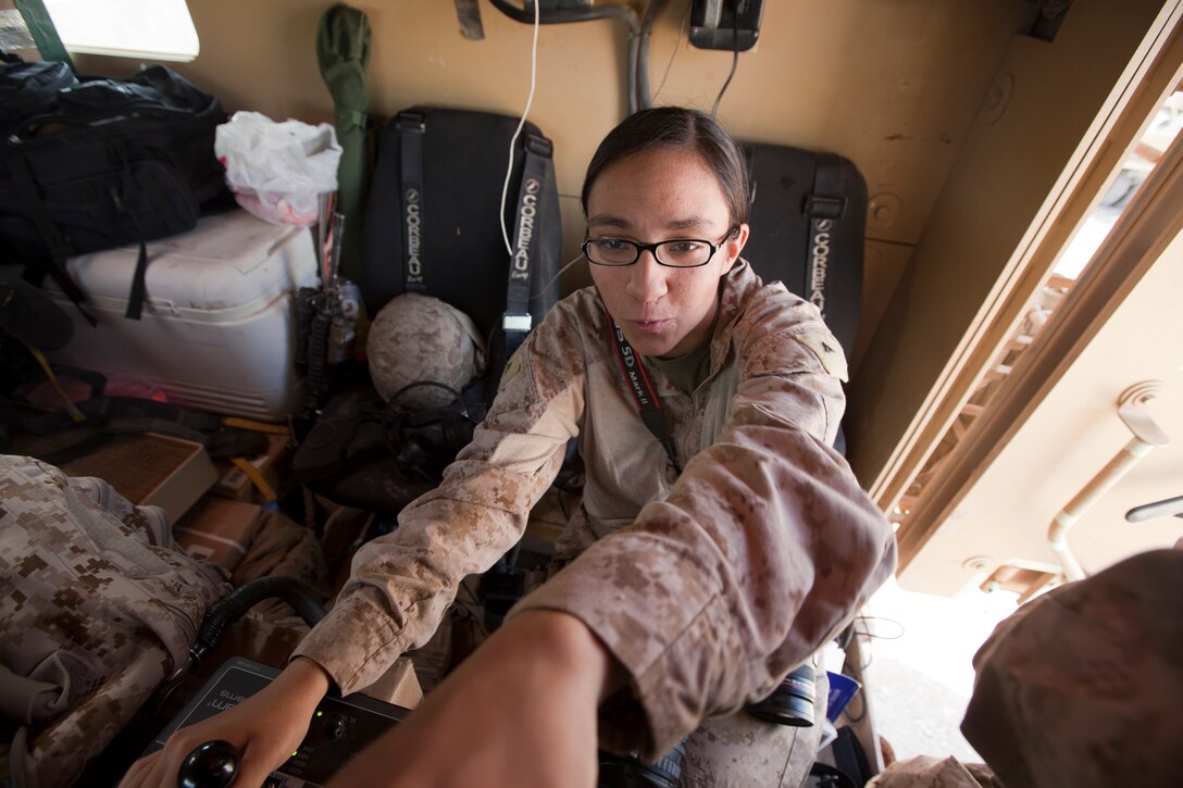 U.S. Marine Corps Lance Cpl. Jessica Gonzalez, a combat videographer, performs an operational check on a vehicle-mounted camera prior to a convoy from Forward Operating Base Apache, Ghazni province, Afghanistan, April 15, 2011. Gonzalez is with the 2nd Marine Logistics Group (Forward). (U.S. Marine Corps photo by Lance Cpl. Robert R. Carrasco/Released) 
