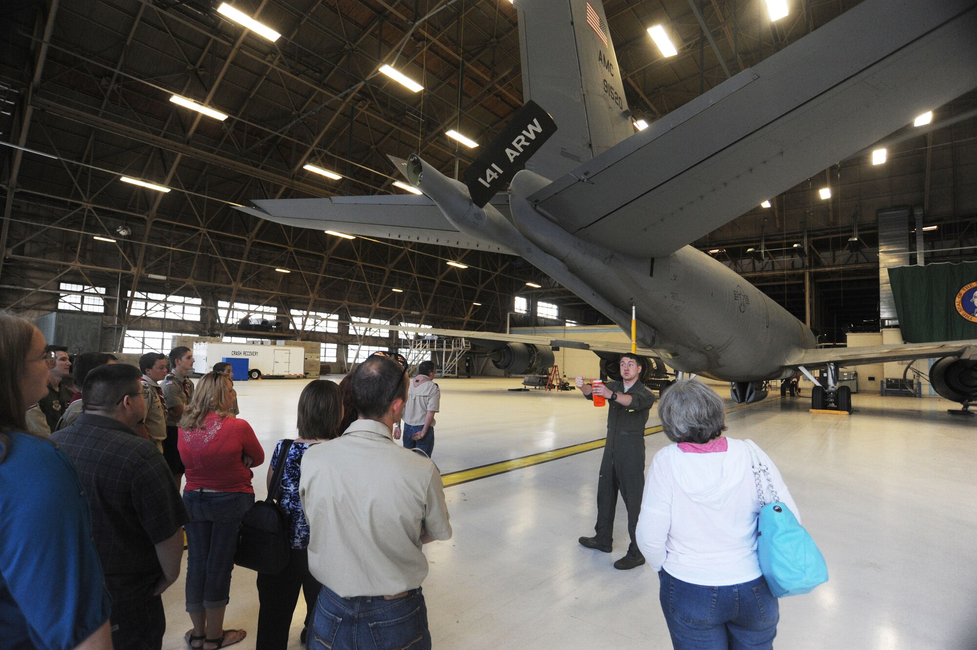 1st Lt. Alex Duke, 92nd Air Refueling Squadron pilot, talks about inflight refueling procedures with members and parents of Boy Scouts Troop 400 at Fairchild Air Force Base, Washington, Sept. 15, 2014. The scouts went on a tour of the base to gain a better grasp of the base’s mission. (U.S. Air Force photo by Airman 1st Class Sam Fogleman/Released)
