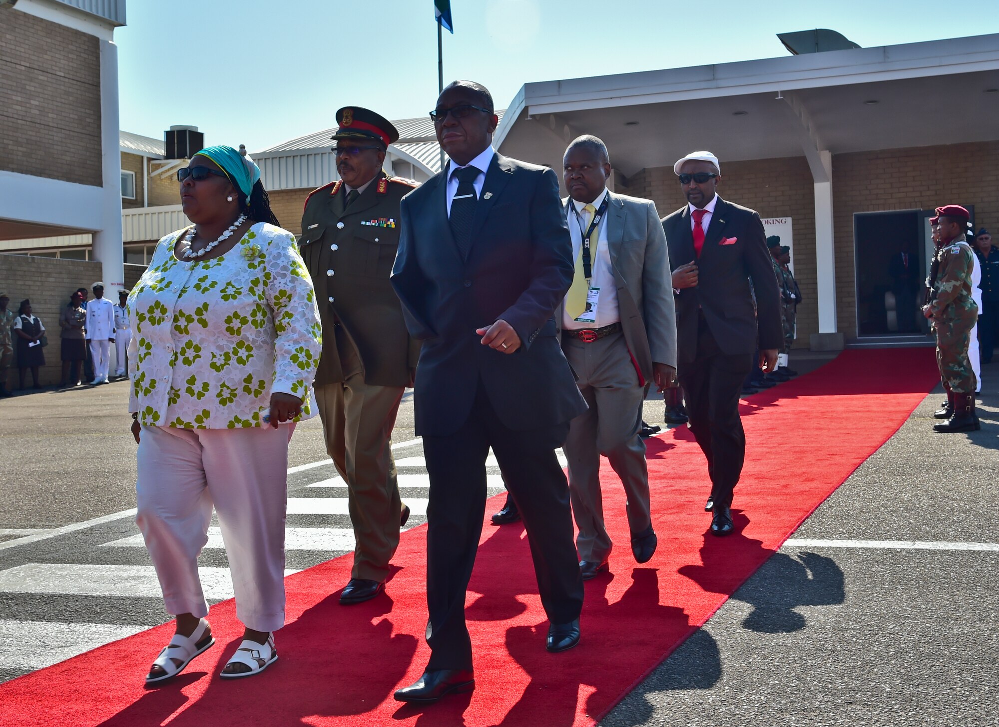 Nosiviwe Noluthando Mapisa-Nqakula (left), South Africa’s Minister of Defense and Military Veterans, walks toward a podium to address senior international defense leaders, patrons and trade-show exhibiters on what Africa Aerospace and Defence Expo 2014 is about Sept. 17, 2014, at Waterkloof Air Force Base, South Africa. Mapisa-Nqakula has been the South African Minister of Defense and Military Veterans since June 2012. (U.S. Air Force photo/Staff Sgt. Travis Edwards-Released)