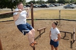 Staff Sgt. Nick Yankosky, 381st Training Squadron medical readiness instructor, and his wife Staff Sgt. Kelly Yankosky, 59th Orthopedics and Rehabilitation Squadron orthopedic technician, participate in a high interval functional training workout together Aug. 27at the Warhawk Fitness Center. These workouts are part of strength and conditioning fitness methodology that capitalizes on the theory of muscle confusion, by performing constantly varied, functional movements at high-intensity. Some of the workouts include Olympic weightlifting, kettlebells, gymnastics rings, pull-up bars, and many calisthenics exercises. (U.S. Air Force photo by Johnny Saldivar)