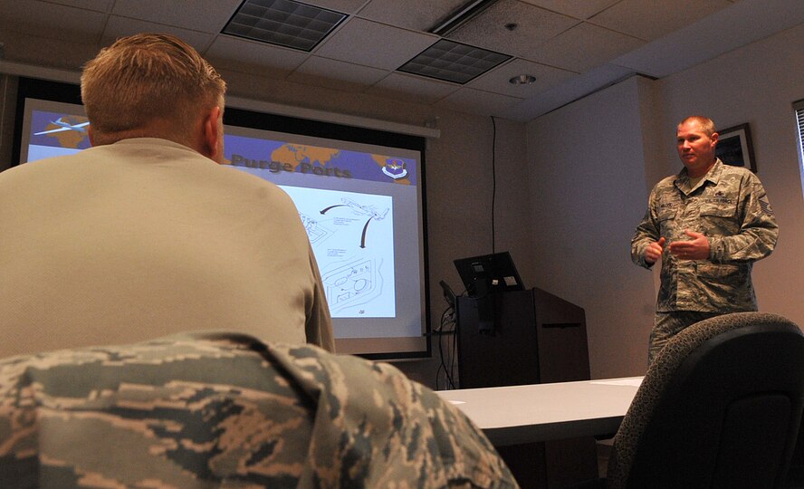 Master Sgt. Christopher Miller, RQ-4 Block 40 Global Hawk maintenance instructor with the 372nd Training Squadron, teaches maintainers with the 69th Reconnaissance Group to be proficient and knowledgeable on the Global Hawk Sept. 17, 2014, on Grand Forks Air Force Base, N.D. Miller was selected as the base's Warrior of the Week for the third week in September. (U.S. Air Force photo/Airman 1st Class Bonnie Grantham)