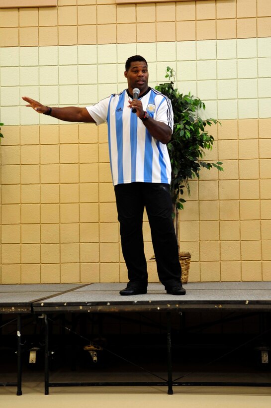 Herschel Walker, Heisman Trophy recipient and mental health advocate, speaks to active-duty U.S. Service members, retirees and others about mental health and his career at Langley Air Force Base, Va., Sept. 17, 2014. Walker spoke about how having dissociative identity disorder played a part in his life. (U.S. Air Force photo by Airman 1st Class Breonna Veal/Released)