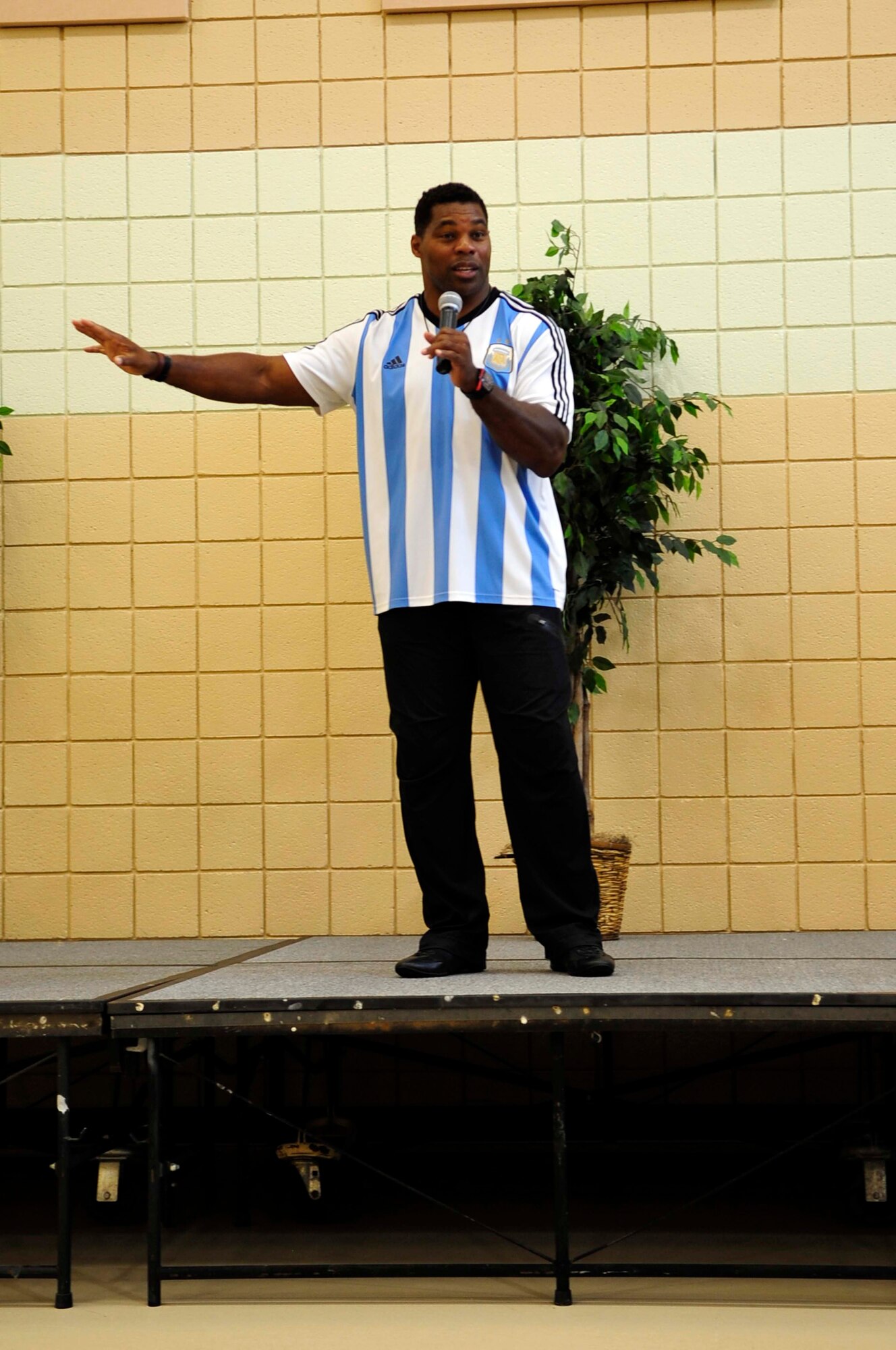 Herschel Walker, Heisman Trophy recipient and mental health advocate, speaks to active-duty U.S. Service members, retirees and others about mental health and his career at Langley Air Force Base, Va., Sept. 17, 2014. Walker spoke about how having dissociative identity disorder played a part in his life. (U.S. Air Force photo by Airman 1st Class Breonna Veal/Released)
