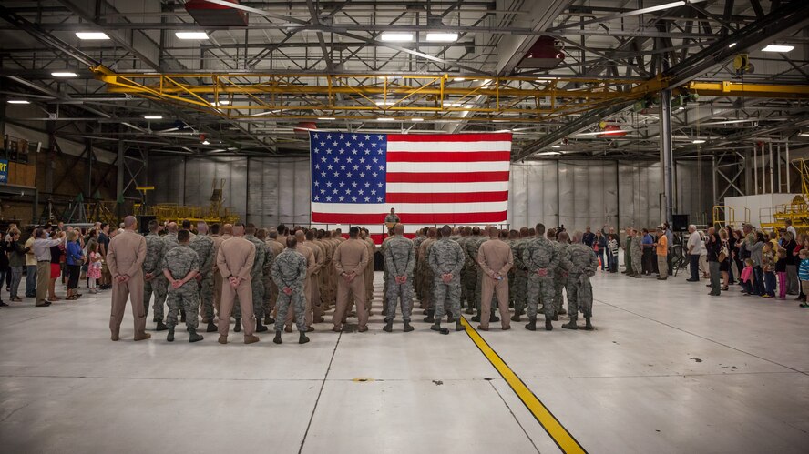 Col. Todd McCubbin, 934th Airlift Wing commander, speaks to Airmen, friends and family during a deployment ceremony as more than 100 Airmen from the 934th Airlift Wing deploy to Southwest Asia Sept. 9, at the Minneapolis-St. Paul Air Reserve Station, Minn.  (U.S. Air Force photo by Shannon McKay/Released)