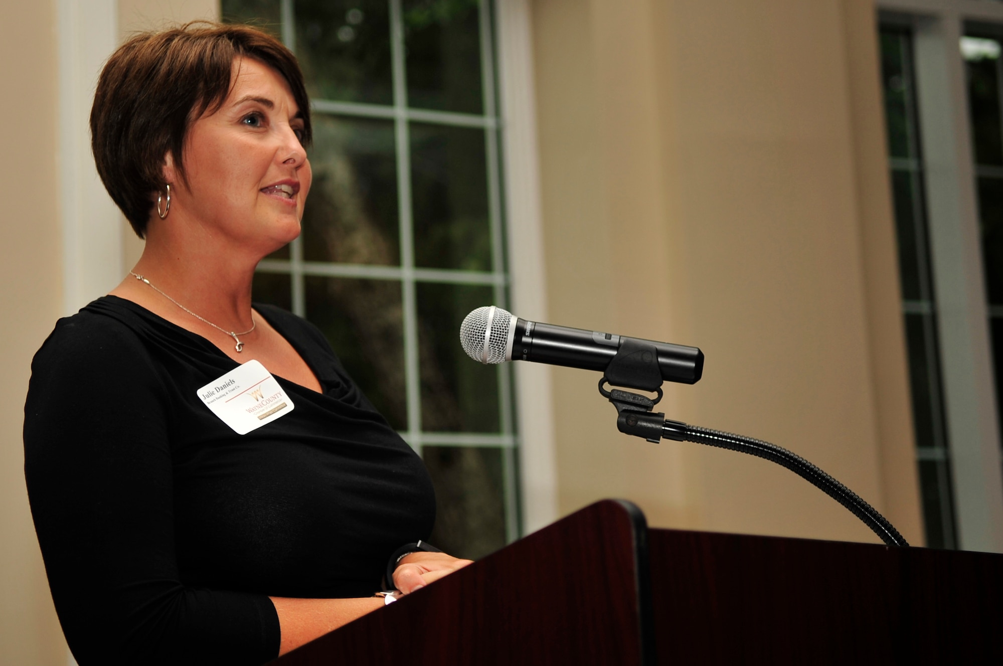 Julie Daniels, honorary commander for the 4th Fighter Wing and chairman of the base Military Affairs Committee, addresses unit commanders and civic leaders during the Seymour Johnson Air Force Base Honorary Commanders induction ceremony Sept. 9. Twenty-seven civic leaders from across the Goldsboro and Wayne County community were inducted as honorary commanders for units on base during the ceremony. The Seymour Johnson AFB Honorary Commanders Program allows community partners and civic leaders to gain awareness of the base’s mission and enables military members and their units to learn more about the neighboring communities. The new honorary commanders are paired with unit commanders and senior leadership from the base. (U.S. Air Force photo/Airman 1st Class Shawna L. Keyes)
