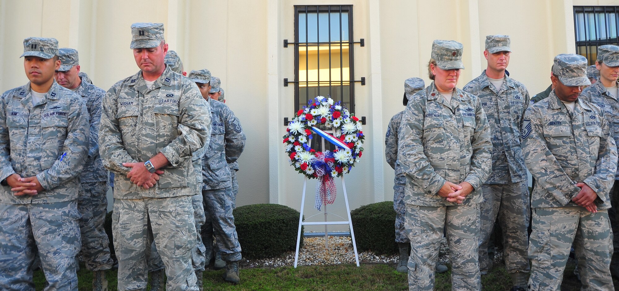 Members of Team Tyndall observe a moment of silence at the 601st Air and Space Operations Center during a memorial service for the men and women who lost their lives during the Sept. 11 terrorist attacks. (U.S. Air Force photo by Tech. Sgt. Veronica Fullwood)       