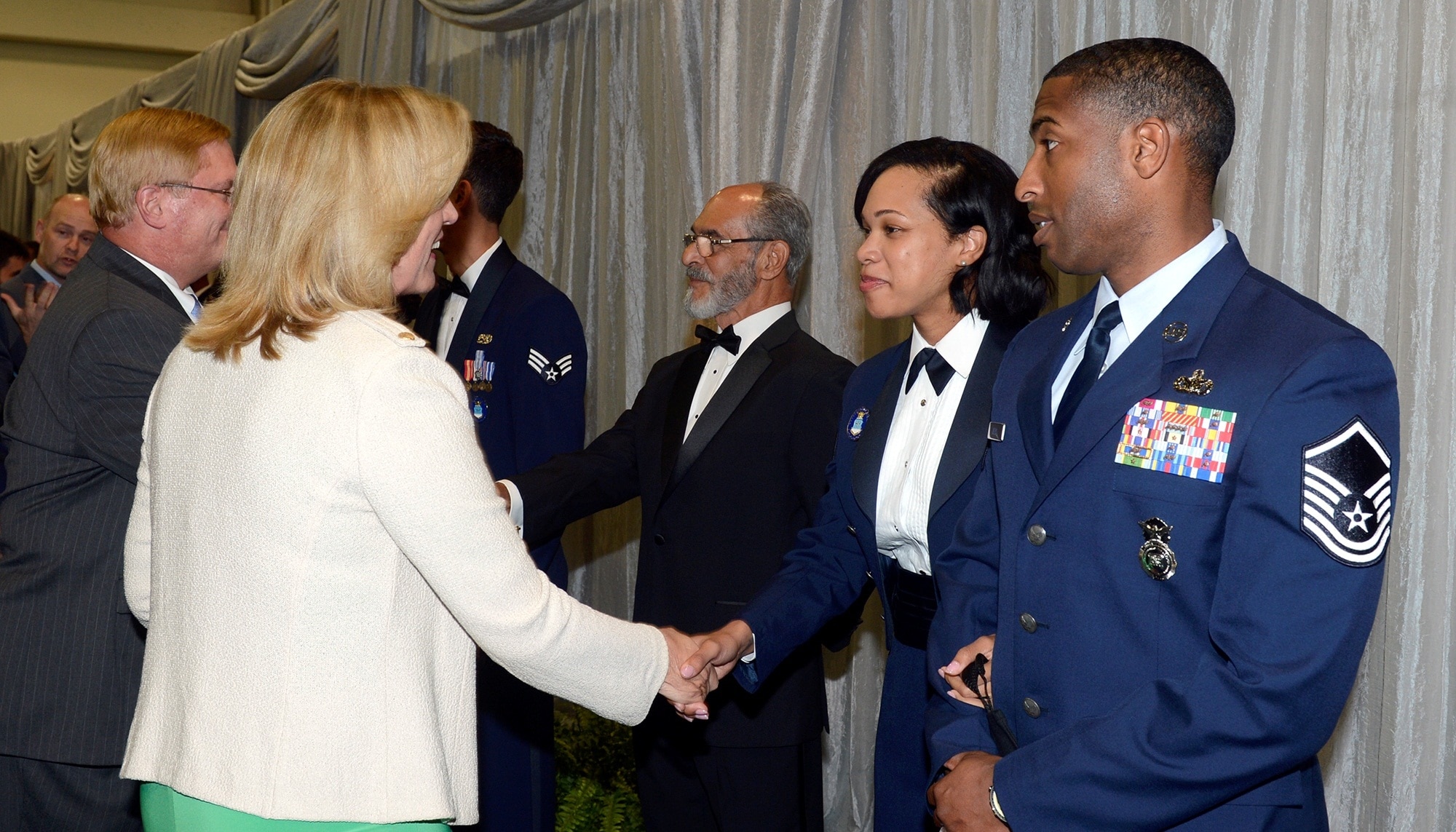 Secretary of the Air Force Deborah Lee James greets Tech. Sgt. Latoria R. Ellis, from the 502nd Contracting Squadron, 502nd Air Base Wing, Joint Base San Antonio-Lackland, Texas. Ellis is one of the 12 Outstanding Airmen of the Year for 2014 who attended a reception and awards dinner during the 2014 Air Force Association's Air & Space Conference and Technology Exposition on Sept. 15, 2014 in Washington, D.C. Other senior leaders in attendance included Chief of Staff of the Air Force General Mark A. Welsh III and his wife, Betty, and Chief Master Sgt. of the Air Force James Cody and his wife, retired Chief Master Sgt. Athena Cody. (U.S. Air Force photo/Andy Morataya)