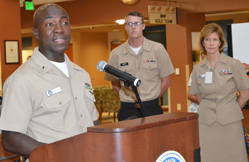 Lt. j.g. Fred Nti, Naval Health Clinic Charleston Materiel Management department head, speaks to an audience of NHCC staff members and patients during a Constitution Day and Citizen Day celebration Sept. 17, 2014, at the NHCC on Joint Base Charleston, S.C.  Nti, who was born and raised in Ghana, Africa, and immigrated to the United States in 1997, spoke about what the U.S. Constitution means to him and about the freedoms the document affords all American citizens.  (U.S. Navy photo/Kris Patterson)