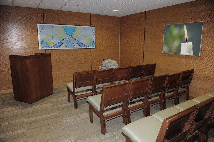 An Airman assigned to Nellis Air Force Base sits in prayer at the new Chapel inside of the Mike O’Callaghan Federal Medical Center at Nellis AFB, Nev., Sept. 15, 2014.  The new chapel, which opened Aug. 25, is available for use 24/7. Anyone visiting the hospital may use the chapel as a place to reflect, pray, meditate, give thanks, or mourn. To celebrate the opening of the chapel, a dedication service has been tentatively scheduled for October. (U.S. Air Force photo by Airman 1st Class Jake Carter)