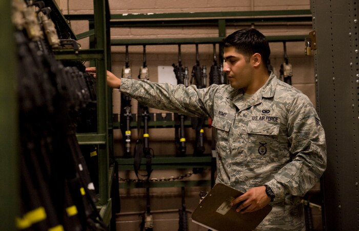 Senior  Airman Jaime Romo, 99th  Security Forces Squadron armorer, performs an equipment inventory at the security forces armory on Nellis Air Force Base Nev., Sept. 12, 2014. Romo performs inventory twice a day to ensure all weapons are present and accounted for. (U.S. Air Force photo by Airman 1st Class Rachel Loftis)