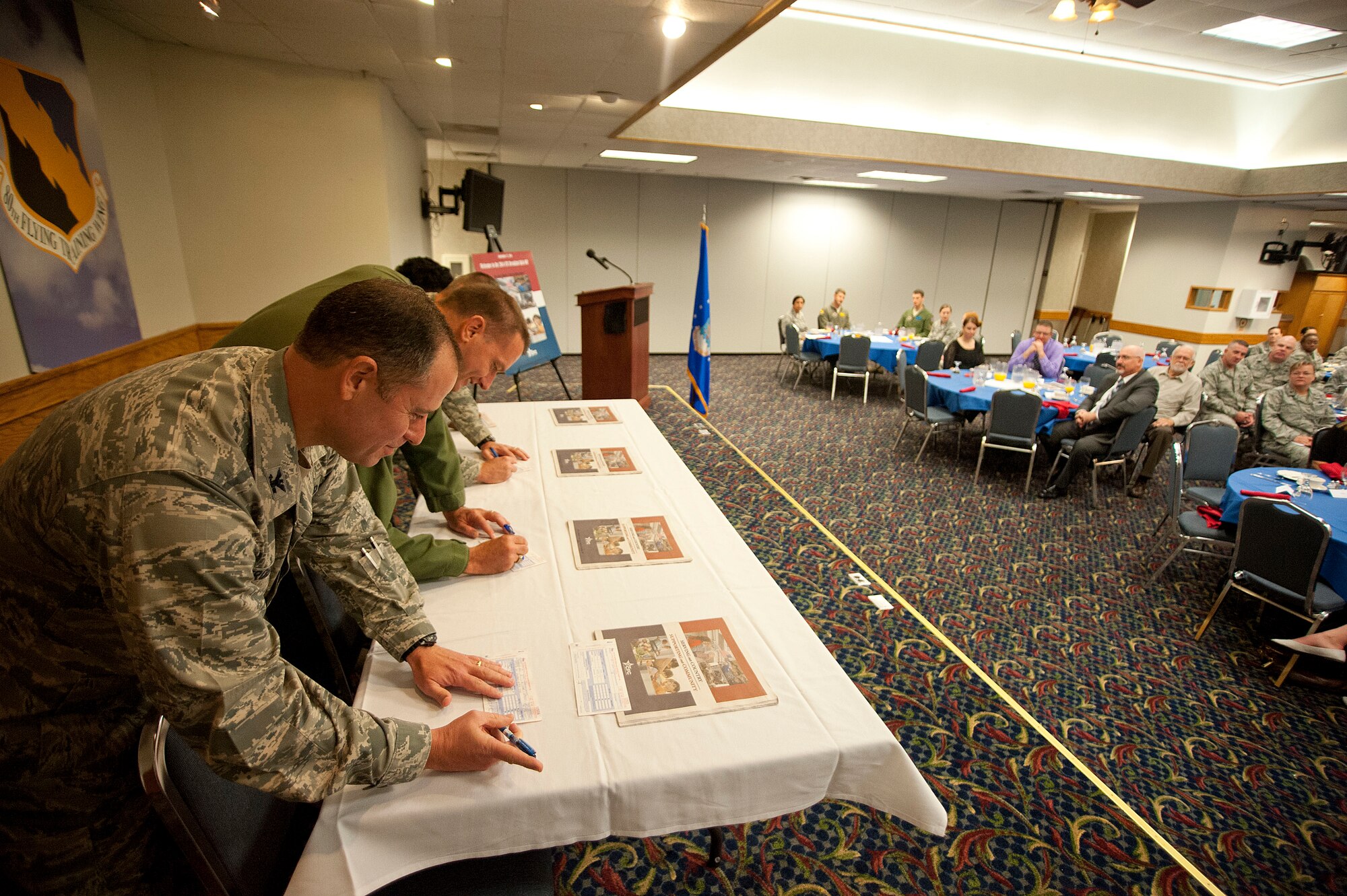 The Combined Federal Campaign breakfast was hosted at the Sheppard Club and a pledge was signed by enlisted base leadership along with Col. Eric Froehlich, 82nd Training Wing vice commander (left) and Col. Lance Bunch (second from left), 80th Flying Training Wing commander, Sept. 17, 2014.  According to the official website, the CFC mission is to "promote and support philanthropy through a program that is employee focused, cost-efficient, and effective in providing all federal employees the opportunity to improve the quality of life for all." (U.S. Air Force photos by Airman 1st Class Jelani Gibson)