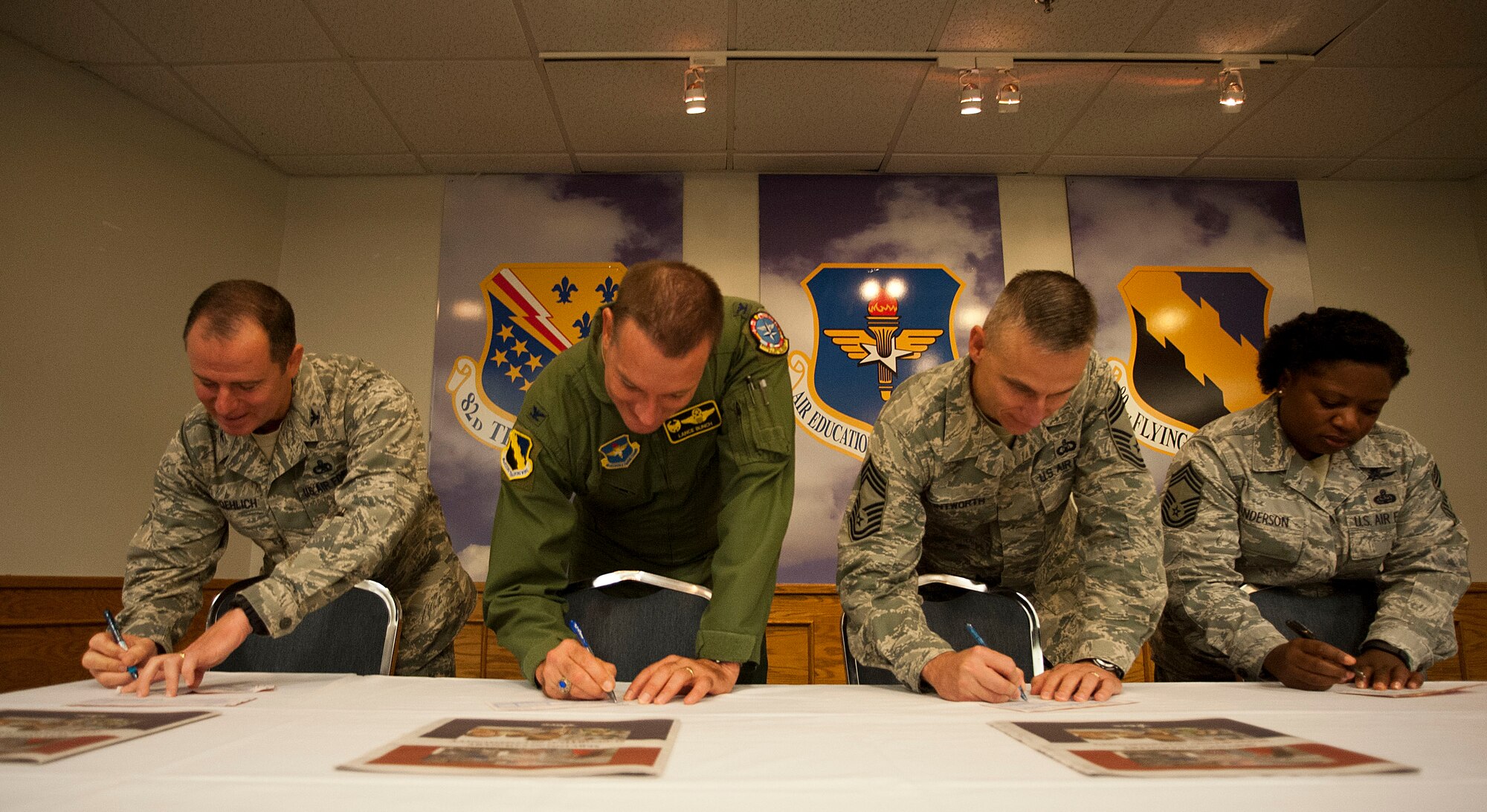 The Combined Federal Campaign breakfast was hosted at the Sheppard Club and a pledge was signed by enlisted base leadership along with Col. Eric Froehlich, 82nd Training Wing vice commander (left) and Col. Lance Bunch (second from left), 80th Flying Training Wing commander, Sept. 17, 2014.  According to the official website, the CFC mission is to "promote and support philanthropy through a program that is employee focused, cost-efficient, and effective in providing all federal employees the opportunity to improve the quality of life for all." (U.S. Air Force photos by Airman 1st Class Jelani Gibson)