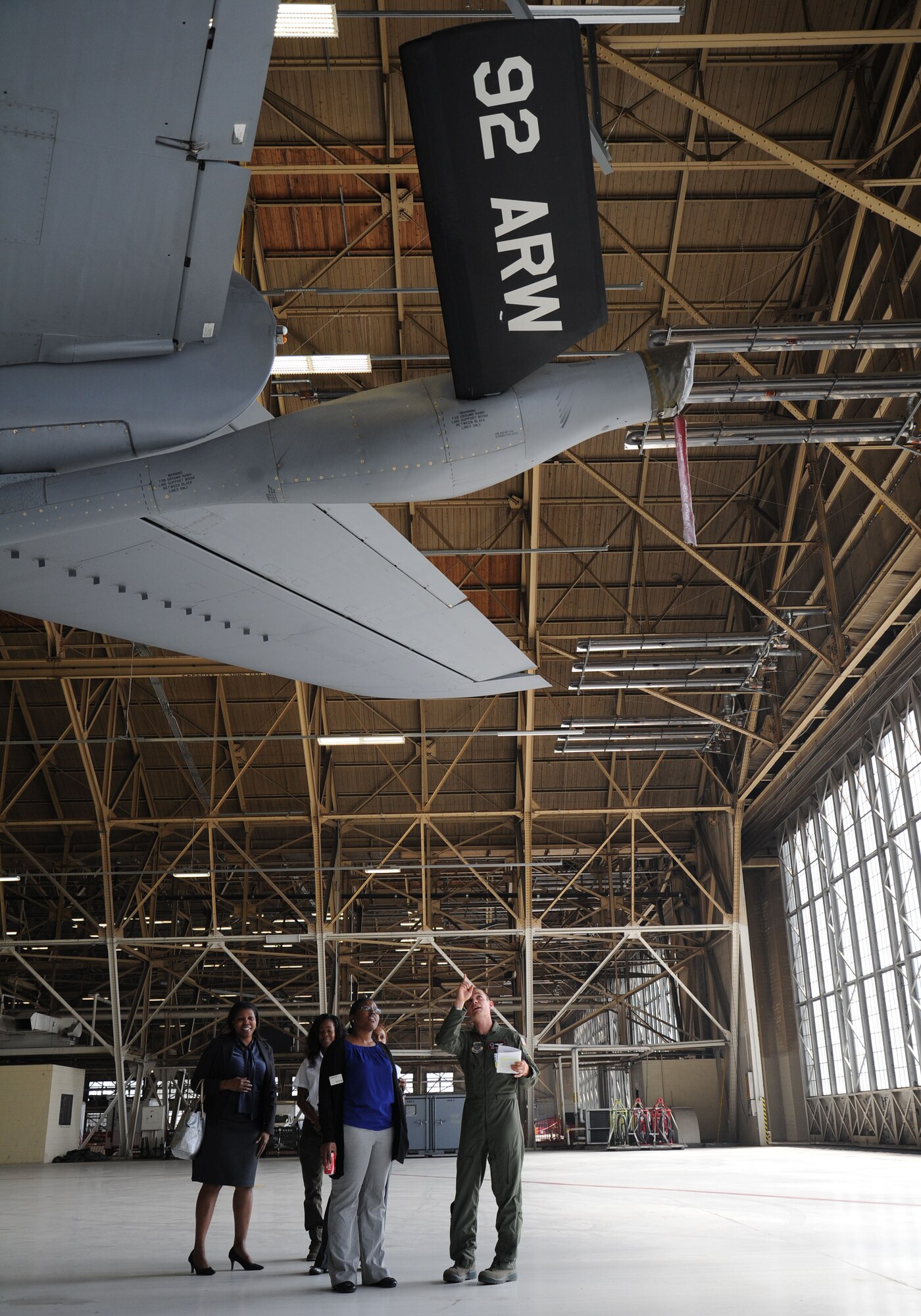 Capt. Joshua Crockett, 92nd Air Refueling Squadron pilot, shows Dr. LaToya Brackett, Eastern Washington University Africana coordinator, and Gayla Thomas, EWU director of equal opportunity, off a KC-135 Stratotanker during a tour at Fairchild Air Force Base, Washington, Sept. 16, 2014. Brackett and Thomas were invited to be the guest speakers at the EO Let’s Talk Leadership Seminar held at the Red Morgan Event Center. (U.S. Air Force photo by Airman 1st Class Janelle Patiño/Released)