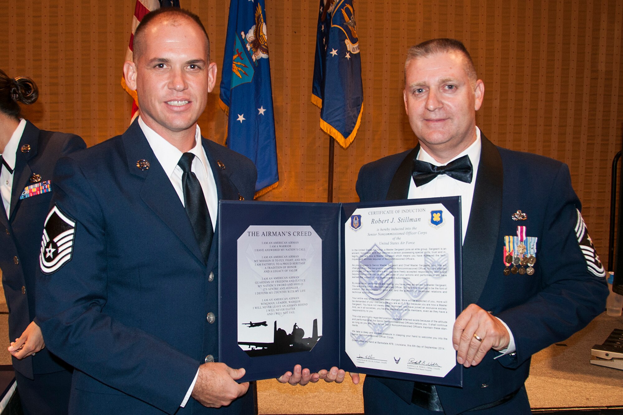 U.S. Air Force Master Sgt. Robert Stillman is presented the Certificate of Induction during a ceremony on Sept. 6, 2014, Bossier City, La. The 307th Bomb Wing Senior Noncommissioned Officer Induction Ceremony is an annual event held to recognize Airmen who were recently promoted to the rank of Master Sergeant. (U.S. Air Force photo by Tech. Sgt. Ted Daigle/Released)
