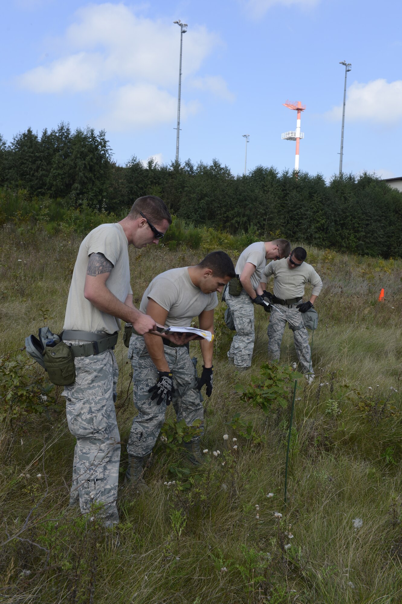 The 724th Air Mobility Squadron from Aviano Air Base, Italy, identifies unexploded ordnance during the 521st Air Mobility Operations Wing Round Up obstacle course held at Spangdahlem Air Base, Germany, Sept. 16, 2014. Airmen used the Air Force Pamphlet 10-100 Airman’s Manual to identify the type of UXO. (U.S. Air Force photo by Staff Sgt. Christopher Ruano/Released)