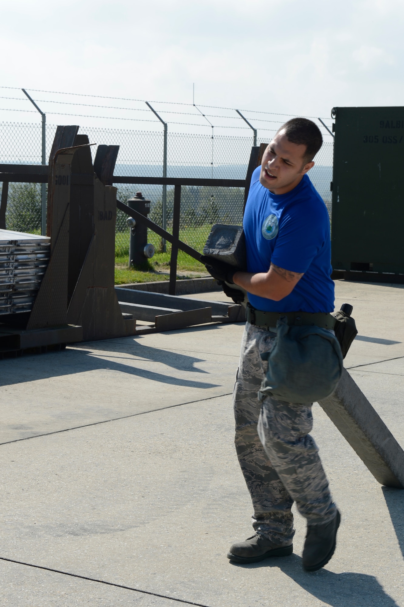 U.S. Air Force Senior Airman John Decker, 729th Air Mobility Squadron Lajes Field, Azores, Portugal, combat readiness cordinator and native of Newport News, Va., carries dunnage during the 521st Air Mobility Operations Wing Round Up obstacle course held at Spangdahlem Air Base, Germany, Sept. 16, 2014. In the aerial port category the 721st Aerial Port Squadron from Ramstein Air Base, Germany, won first place. (U.S. Air Force photo by Staff Sgt. Christopher Ruano/Released)
