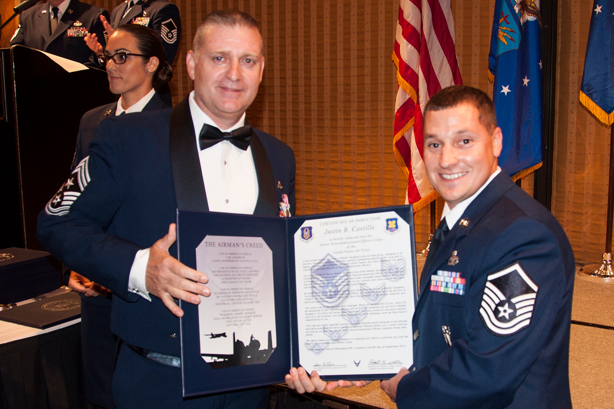 U.S. Air Force Master Sgt. Justin Castille is presented the Certificate of Induction during a ceremony on Sept. 6, 2014, Bossier City, La. The 307th Bomb Wing Senior Noncommissioned Officer Induction Ceremony is an annual event held to recognize Airmen who were recently promoted to the rank of Master Sergeant. (U.S. Air Force photo by Tech. Sgt. Ted Daigle/Released)