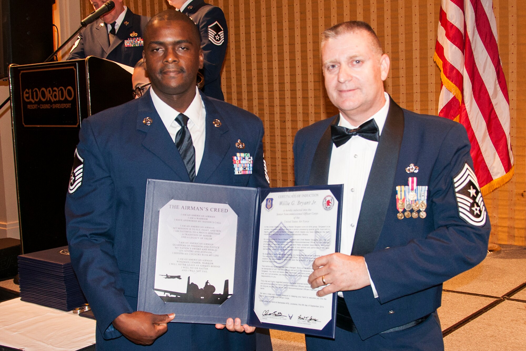 U.S. Air Force Master Sgt. Willie Bryant is presented the Certificate of Induction during a ceremony on Sept. 6, 2014, Bossier City, La. The 307th Bomb Wing Senior Noncommissioned Officer Induction Ceremony is an annual event held to recognize Airmen who were recently promoted to the rank of Master Sergeant. (U.S. Air Force photo by Tech. Sgt. Ted Daigle/Released)