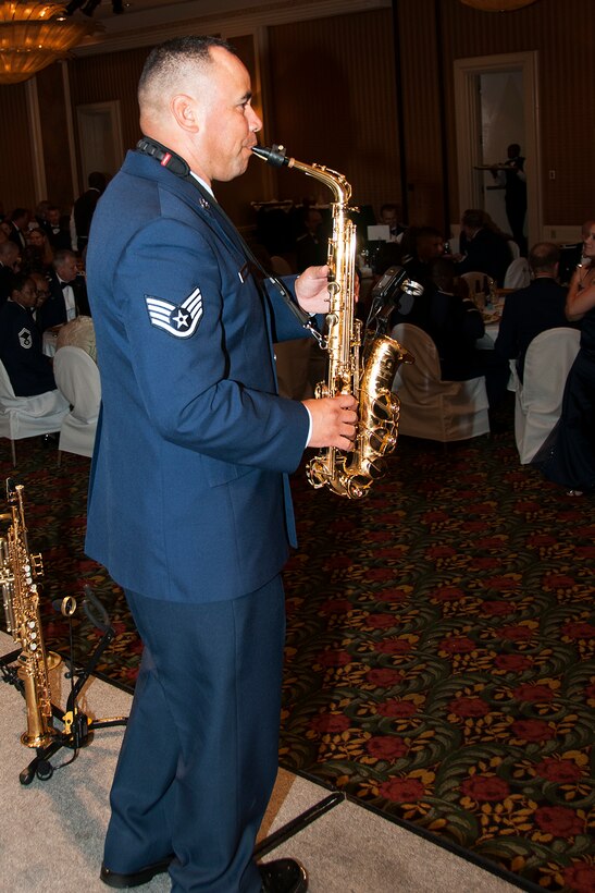 U.S. Air Force Staff Sgt. Johnny Holiday performs during the 307th Bomb Wing's Senior Noncommissioned Officer Ceremony, Sept. 6, 2014, Bossier City, La. Holiday is assigned to the 610th Security Forces Squadron, Carswell Naval Air Station Joint Reserve Base, Fort Worth, Texas, and performs for military members around the world. (U.S. Air Force photo by Tech. Sgt. Ted Daigle/Released)