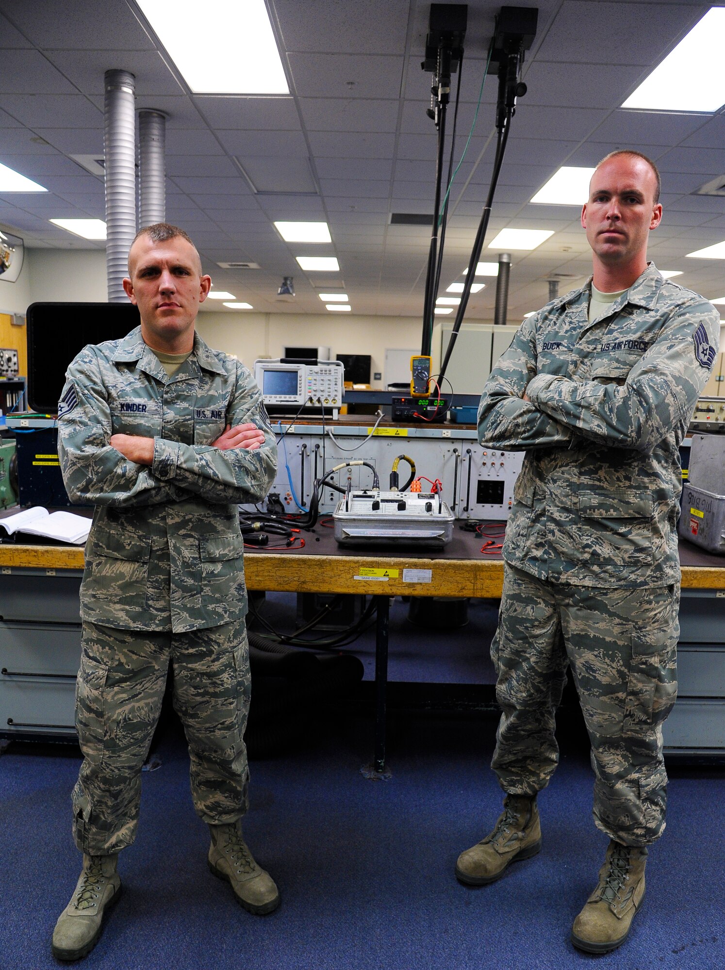 Staff Sgts. Justin Kinder, left, and Nick Buck, 341st Maintenance Operations Squadron electronics laboratory team, pose for a photograph after a training session at Malmstrom Air Force Base Aug. 25. The team is one of nine from the base that will be competing in the 2014 Air Force Global Strike Challenge. (U.S. Air Force photo/Airman 1st Class Collin Schmidt)