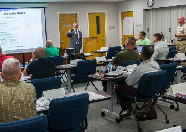 Kevin Hawks, transition assistance counselor, leads a class in the Airman and Family Readiness Center, Sept. 15, 2014 at Joint Base Charleston, S.C. The A&FRC and Fleet and Family Support Center provide service members and their families the tools, training and guidance they need to navigate the unique challenges of military service. (U.S. Air Force photo/Staff Sgt. William O'Brien)