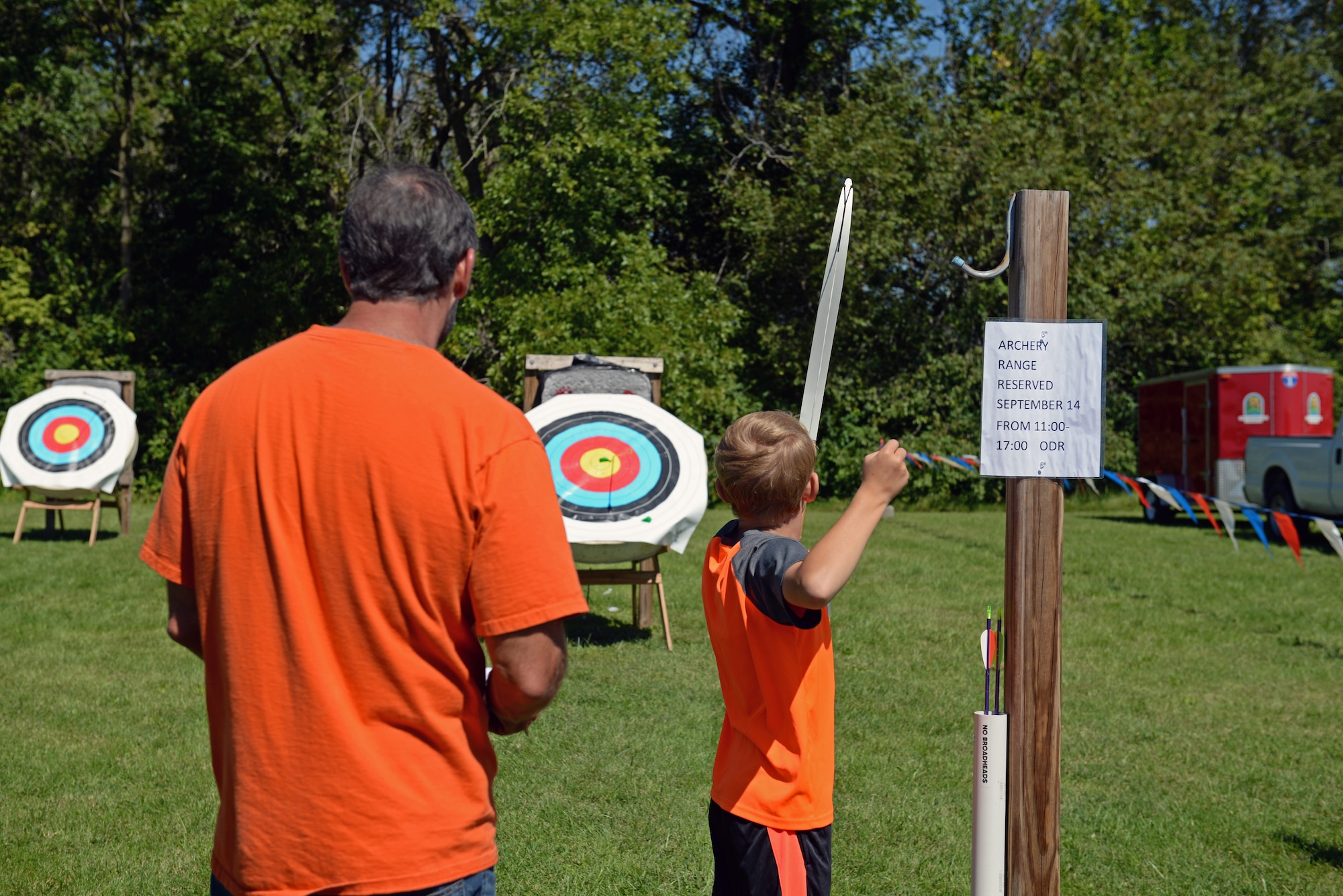 Riley Sabol, a young competitor, looks at the balloon he just popped on the target during an archery tournament at Scott Air Force Base, Ill., Sept. 14, 2014. He was the only participant to pop the balloon during the final shot. The event was hosted by Scott AFB Outdoor Recreation and had around two dozen participants. Four age categories allowed people of all ages and levels of expertise to compete. The archery range was rebuilt by an Eagle Scout a few years ago. (U.S. Air Force photo by Airman 1st Class Erica Crossen)