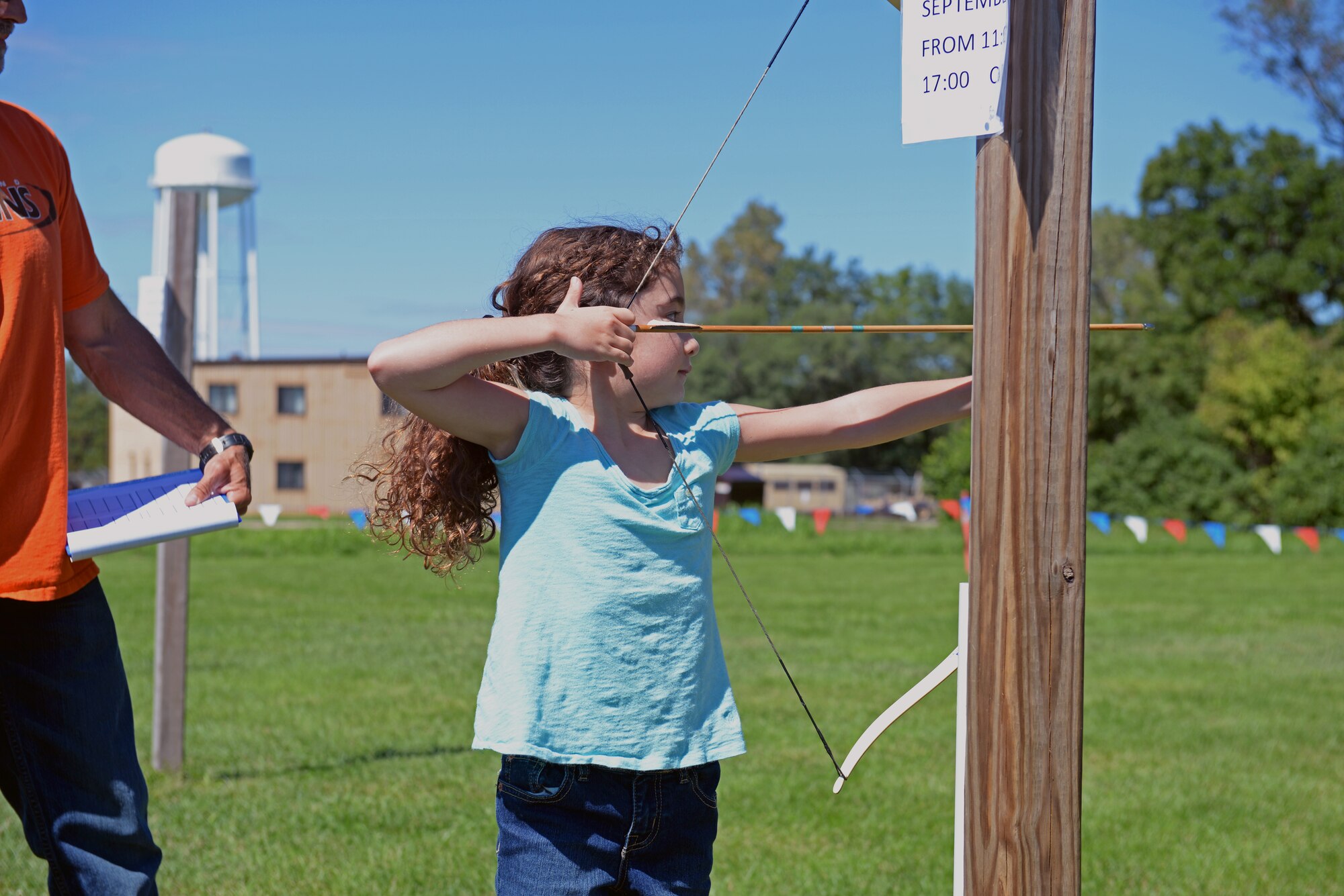 A young competitor at the archery range aims for the target during an archery tournament at Scott Air Force Base, Ill., Sept. 14, 2014. The event was hosted by Scott AFB Outdoor Recreation and had around two dozen participants. ODR is planning to host a spring tourney, where compound bows can be used. Four age categories allowed people of all ages and levels of expertise to compete. The archery range was rebuilt by an Eagle Scout a few years ago. (U.S. Air Force photo by Airman 1st Class Erica Crossen)