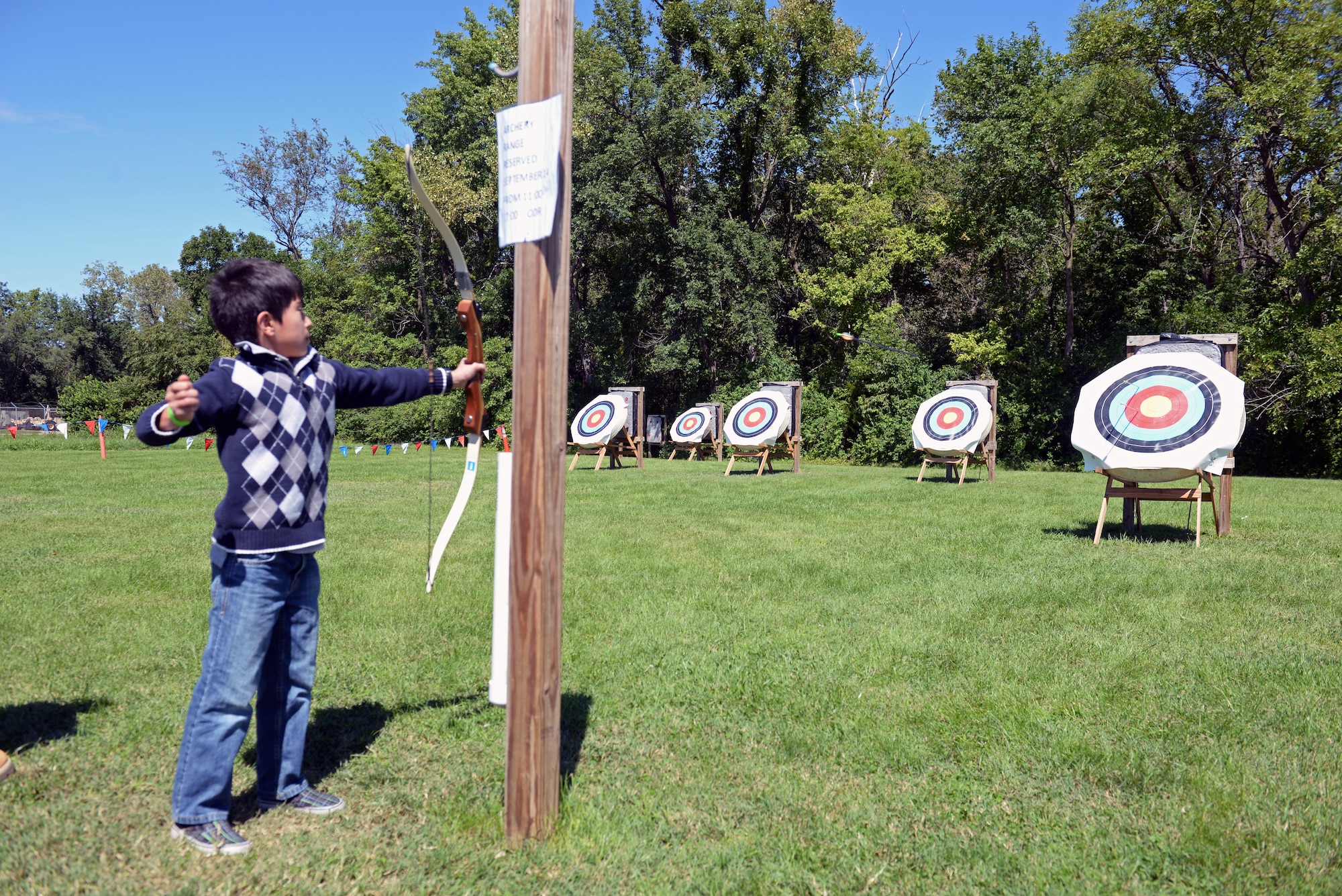 A competitor at the archery range aims for the target during an archery tournament at Scott Air Force Base, Ill., Sept. 14, 2014. The event was hosted by Scott AFB Outdoor Recreation and had around two dozen participants. Archery equipment can be rented from ODR to use at Scott's archery range. The archery range was rebuilt by an Eagle Scout a few years ago. (U.S. Air Force photo by Airman 1st Class Erica Crossen)