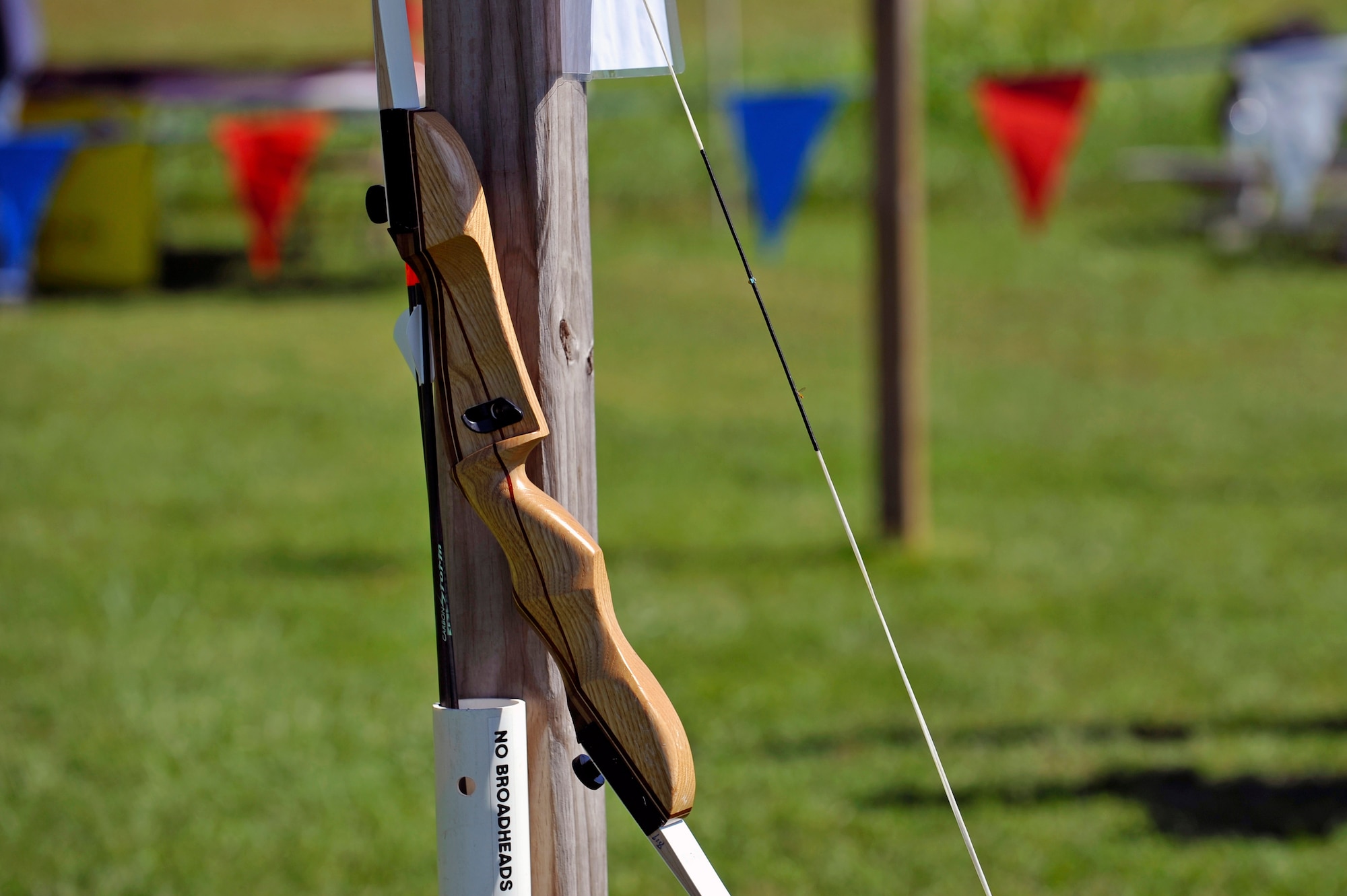 A recurve bow hangs ready to be used during an archery tournament at Scott Air Force Base, Ill., Sept. 14, 2014. The event was hosted by Scott AFB Outdoor Recreation and had around two dozen participants. There were four age categories to place in. The archery range was rebuilt by Jack Hilbing, an Eagle Scout, a few years ago. (U.S. Air Force photo by Airman 1st Class Erica Crossen)
