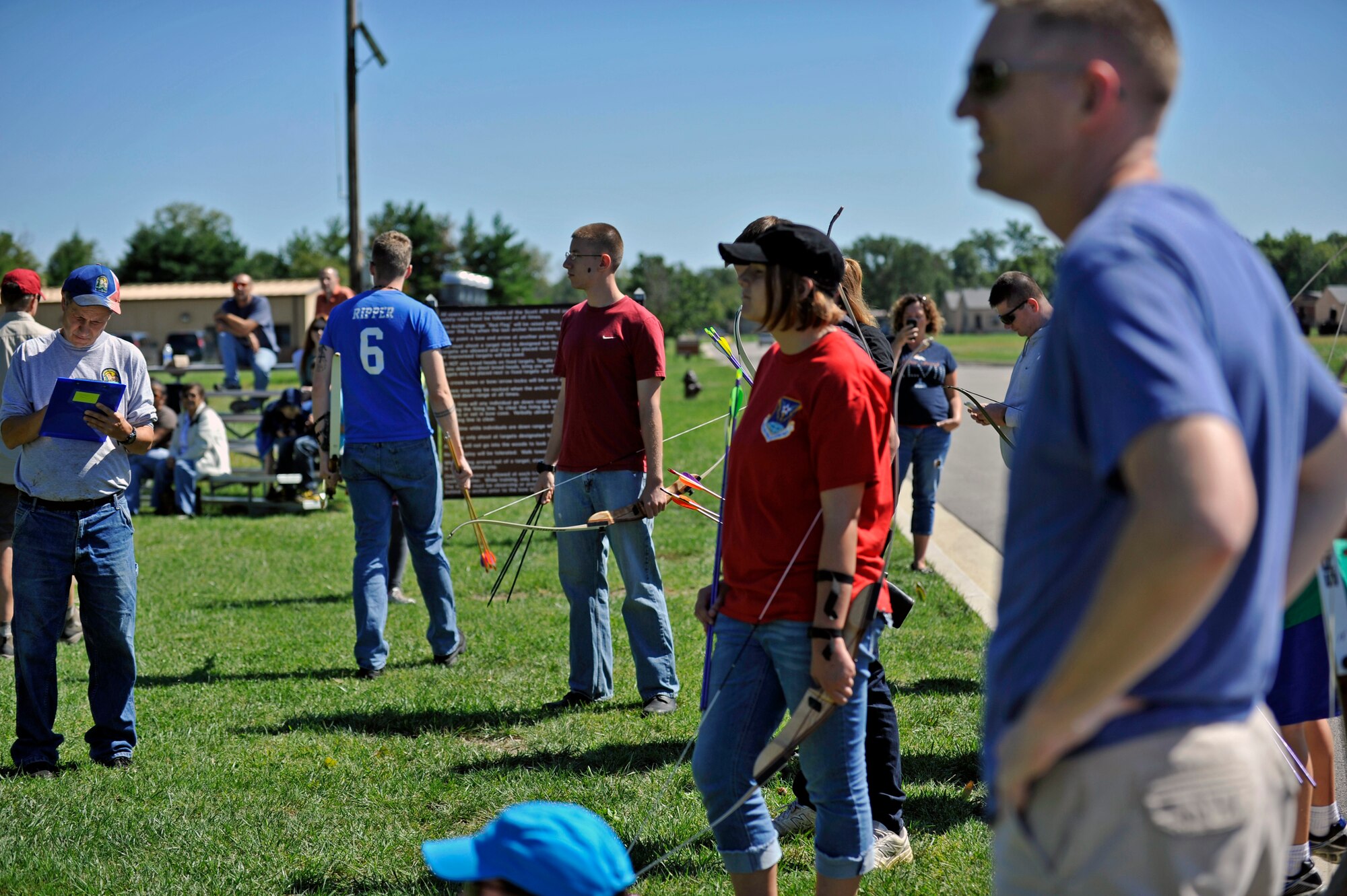 Competitors and onlookers wait for the next age category to shoot during an archery tournament at Scott Air Force Base, Ill., Sept. 14, 2014. The event was hosted by Scott AFB Outdoor Recreation and had around two dozen participants. There were four age categories to place in. The archery range was rebuilt by an Eagle Scout a few years ago. (U.S. Air Force photo by Airman 1st Class Erica Crossen)