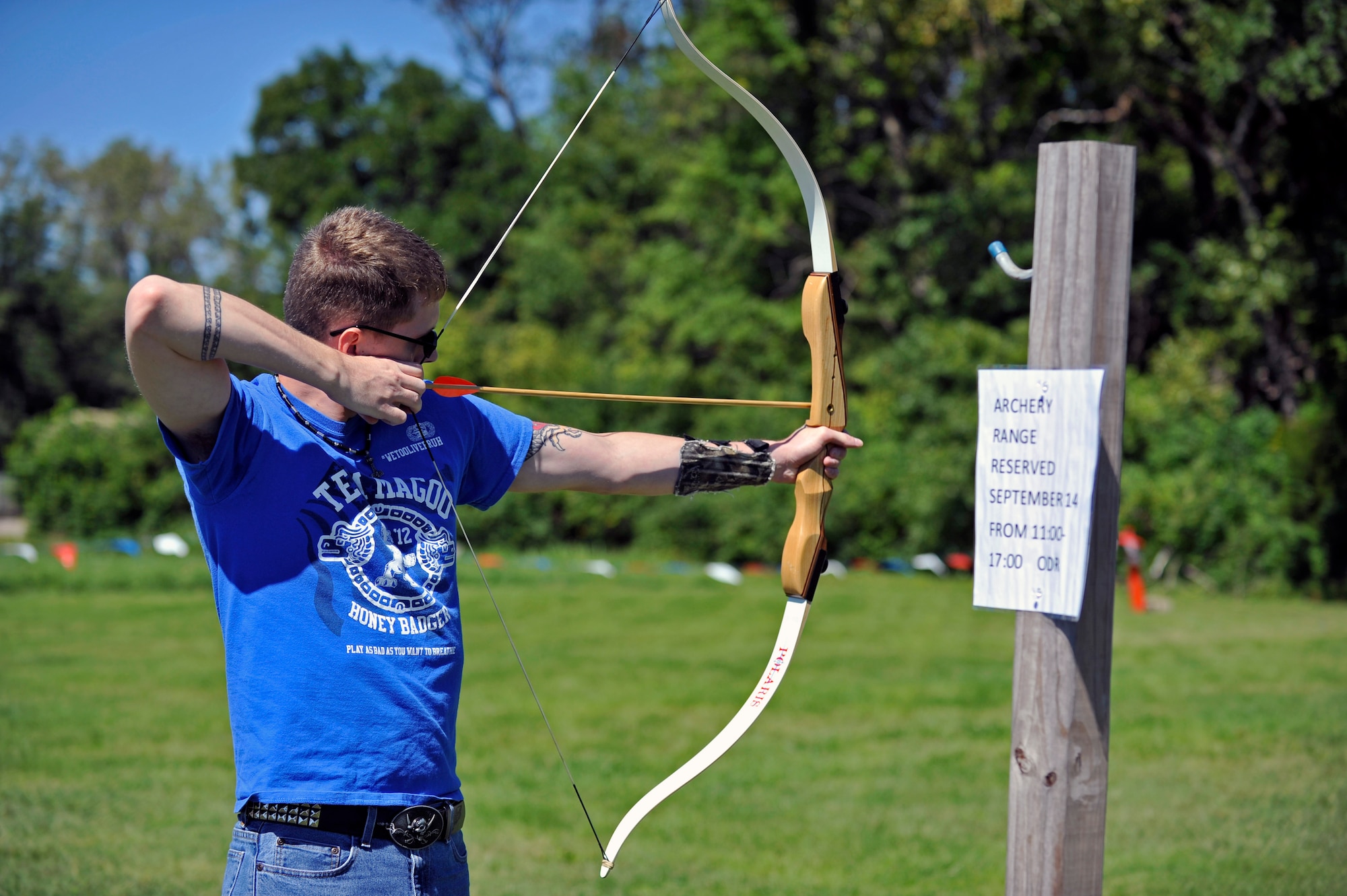 Senior Airman John Leonard aims for his target during an archery tournament at Scott Air Force Base, Ill., Sept. 14, 2014. Leonard is with 436th Supply Chain Operations Squadron. The event was hosted by Scott AFB Outdoor Recreation and had around two dozen participants. There were four age categories to place in. The archery range was rebuilt by an Eagle Scout a few years ago. (U.S. Air Force photo by Airman 1st Class Erica Crossen)