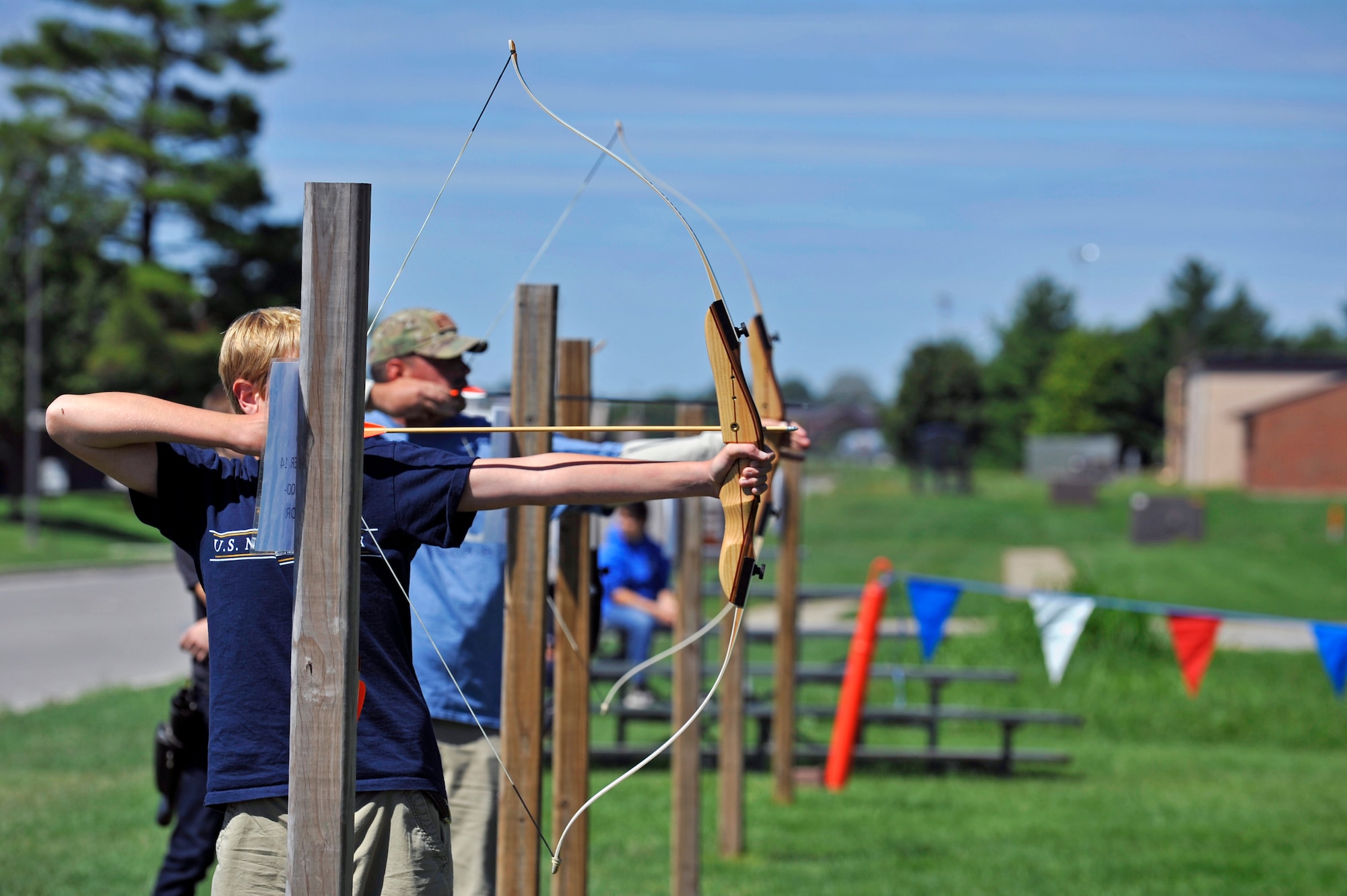 Competitors at the archery range take aim at their targets during an archery tournament at Scott Air Force Base, Ill., Sept. 14, 2014. The event was hosted by Scott AFB Outdoor Recreation and had around two dozen participants. The archery range was rebuilt by an Eagle Scout a few years ago. (U.S. Air Force photo by Airman 1st Class Erica Crossen)