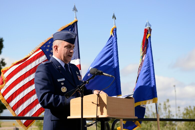 Col. Marc Caughey, 50th Space Wing vice commander, speaks during the 9/11 commemoration Sept. 11, 2014, Schriever Air Force Base, Colo.  Caughey recalled the events of that tragic day while serving at the Pentagon when a plane crashed into the west side of the building. (Air Force photo/ Christopher DeWitt)  