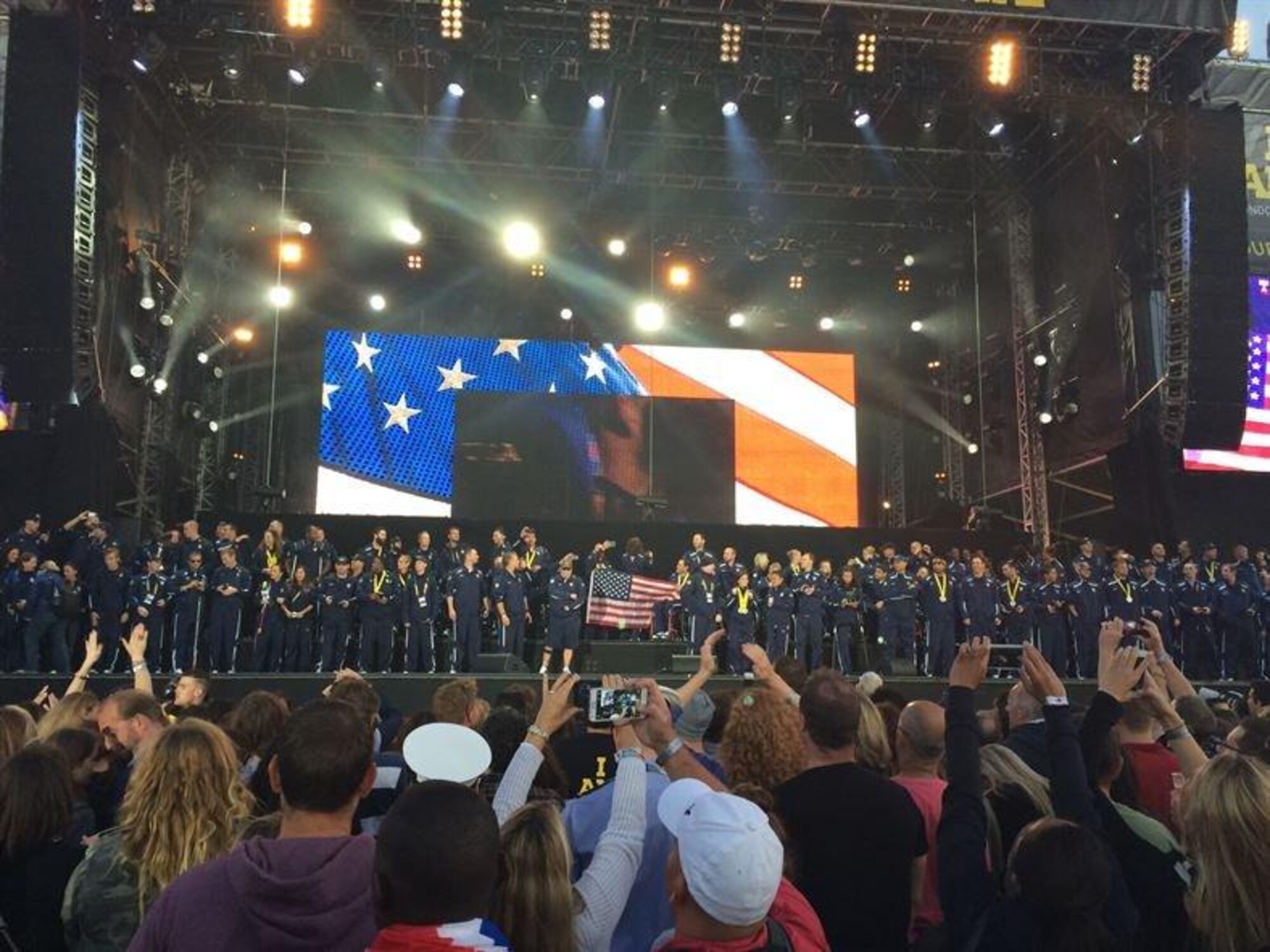 USA Team members gather to be recognized on stage Sept. 14, 2014, at the closing ceremony of the Invictus Games in London. Approximately 26,000 people were on hand for the event. The games featured athletes competing in various Paralympic-style events, including swimming, track and field, seated volleyball, wheelchair basketball, and wheelchair rugby, among others. (Courtesy photo)

