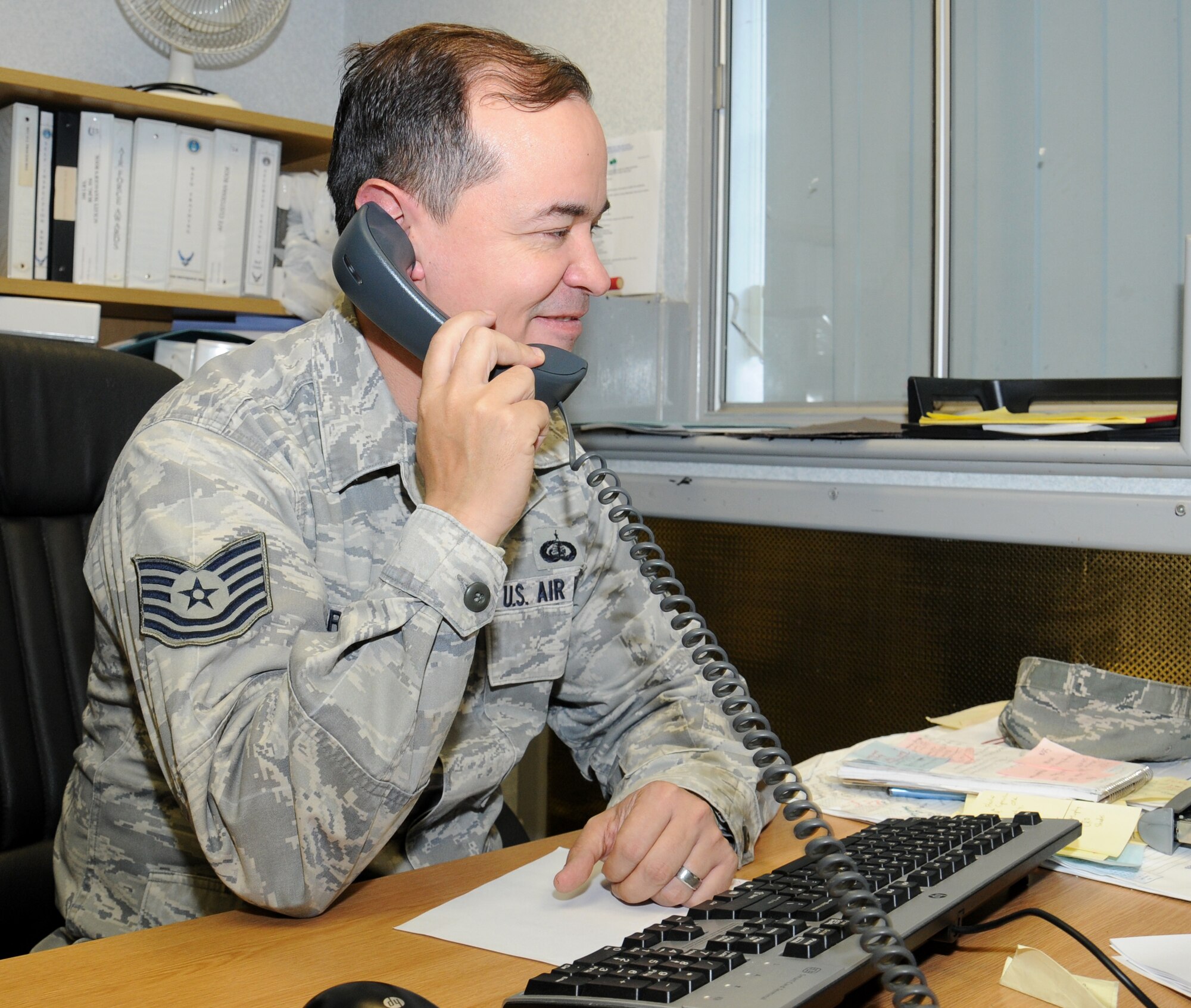 U.S. Air Force Tech. Sgt. Michael Graydon, 100th Logistics Readiness Squadron NCO in charge of customer support from Belvidere, Ill., takes a call Sept. 9, 2014, on RAF Mildenhall, England. The commander’s support staff takes care of all the administration items that need to be accomplished on behalf of the commander including performance reports, decorations, drug demand reduction program, fitness program and more. (U.S. Air Force photo/Gina Randall/Released)