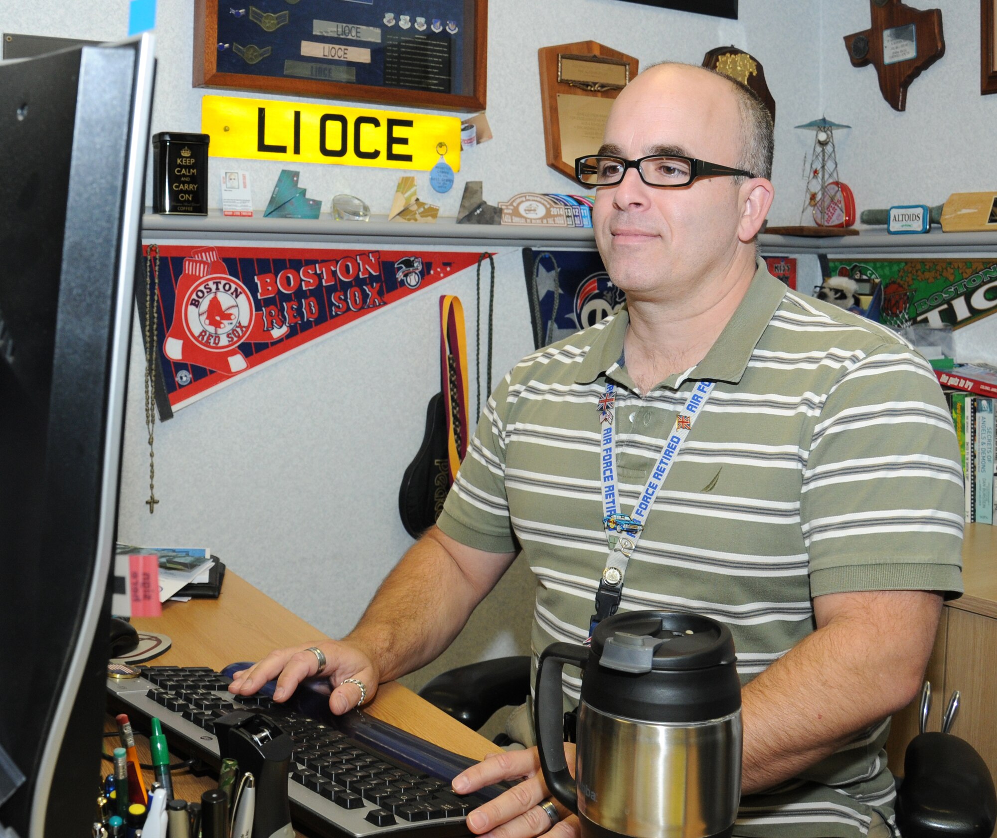 Michael Lioce, 100th Logistics Readiness Squadron commander’s support staff representative from Hopedale, Mass., updates a personnel file Sept. 9, 2014, on RAF Mildenhall, England. Lioce has many duties including unit security manager, functional area records manager, defense travel system administrator, personnel updates monitor, decorations monitor (reviews and routes all the squadron decorations), issues ration cards and sponsorship program administrator. (U.S. Air Force photo/Gina Randall/Released)
