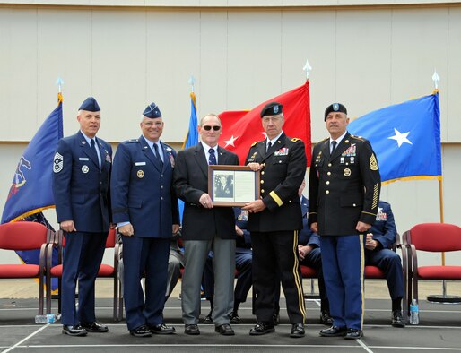 Brigadier General
(Retired) William Boardley, center, receives his Pa Air National Guard Hall of
Fame plaque from Major General Wesley Craig Pa National Guard Adjutant General
at the annual Flight of Freedom ceremony held on Sunday, Sept 16th.  (Pa Air
National Guard photo by Master Sgt. Chris Botzum)
