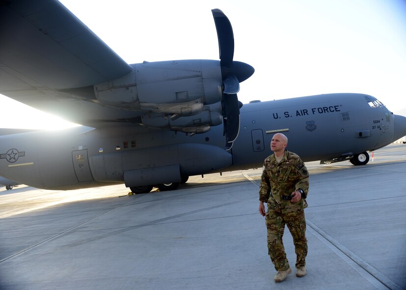 U.S. Air Force Lt. Col. Joseph Miller, 774th Expeditionary Airlift Squadron commander, walks around a C-130J Super Hercules aircraft at Bagram Airfield, Afghanistan Sept. 12, 2014.  The unit redeployed to their home base Dyess Air Force Base, Texas.  The 41st Airlift Squadron from Little Rock, Arkansas replaced the unit. The 774 EAS supported various tactical airlift capabilities including airdrop operations as well as humanitarian efforts and aeromedical evacuation. (U.S. Air Force photo by Staff Sgt. Evelyn Chavez/Released)