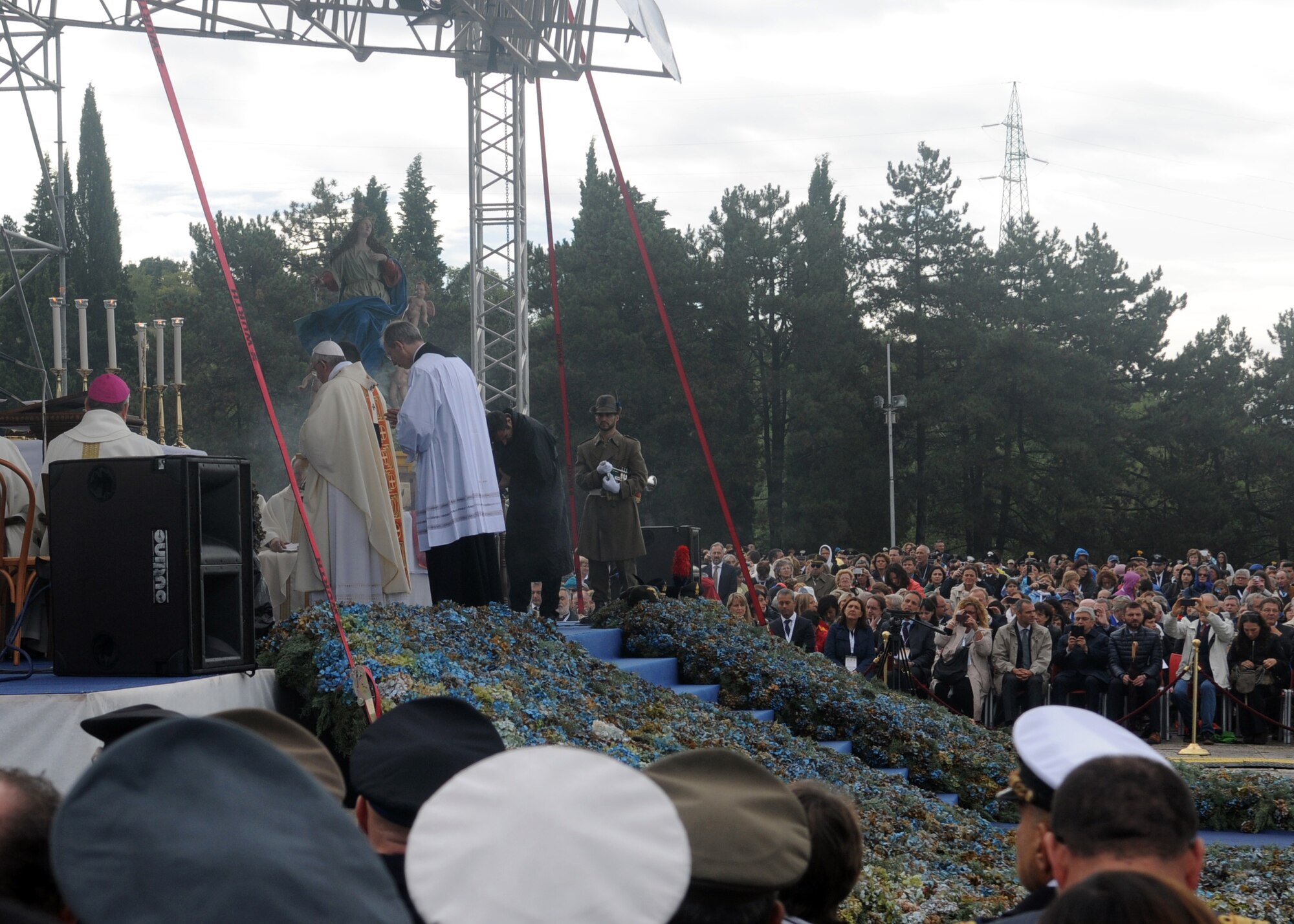 During a special mass held at the Redipuglia Italian War Memorial, Pope Francis honors the lives lost during all world wars, Sept. 13, 2014, at Redipuglia, Gorizia. The memorial is Italy’s largest war memorial; dedicated to the more than 100,000 Italians buried there who lost their lives during World War I. Members of Team Aviano traveled with the base chapel to pay respects to the Pope and honor those who paid the ultimate sacrifice. (Photo by Monica Del Rizzo)