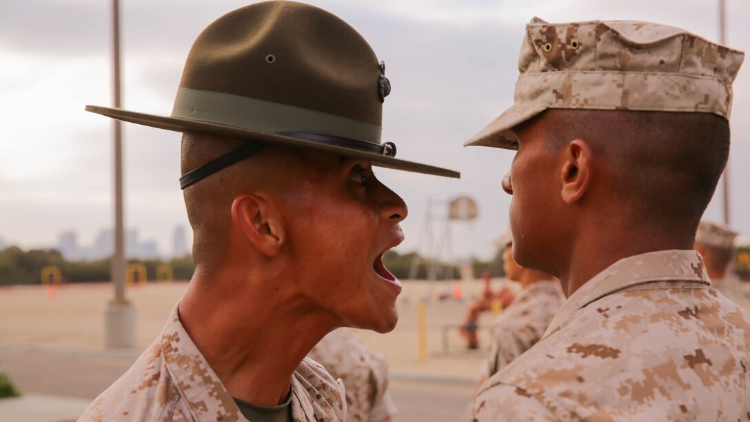 A Recruit of India Company, 3rd Recruit Training Battalion, stands at attention as he is inspected by a drill instructor during the senior drill instructor’s inspection at Marine Corps Recruit Depot San Diego, Sept. 5. Other drill instructors swarmed the platoon creating chaos, testing the recruits’ bearing, one of the Marine Corps leadership traits. 