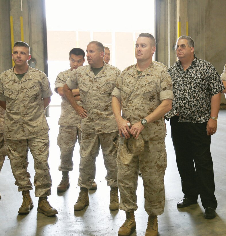 Members of the Operational-Level Logistics Operational Advisory Group attend a briefing on the capabilities of the Marine Corps Logistics Command's Distribution Management Center, recently