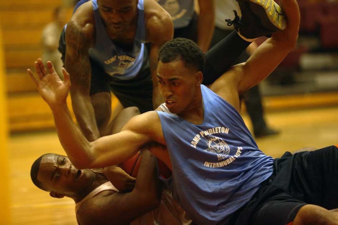 CAMP PENDLETON, Calif. - The 1st Medical Battalion beat the 1st Combat Engineer Battalion 44-34 at the Paige Fieldhouse basketball court, Sept. 16. 1st Med. Bn. is ranked sixth overall and 1st CEB is ranked fifth over all. The top eight teams will advance to the play offs starting next week. (Photo by Cpl. Keenan Zelazoski)