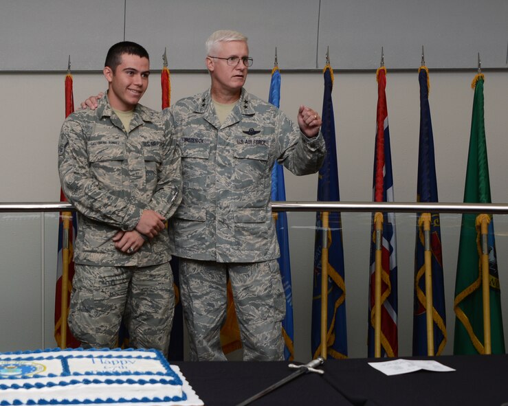 Maj. Gen. Norm Brozenick, Air Force Special Operations Command vice commander, gives a speech on Air Force history before Airman Rickey Castorena-Ramirez, AFSOC Commander's Support Staff, cuts the cake as the youngest Airman in Headquarters AFSOC Sept. 18, 2014, Hurlburt Field, Fla. AFSOC held a cake-cutting ceremony in celebration of the Air Force's 67th birthday. (U.S. Air Force photo by Capt. Victoria Porto)